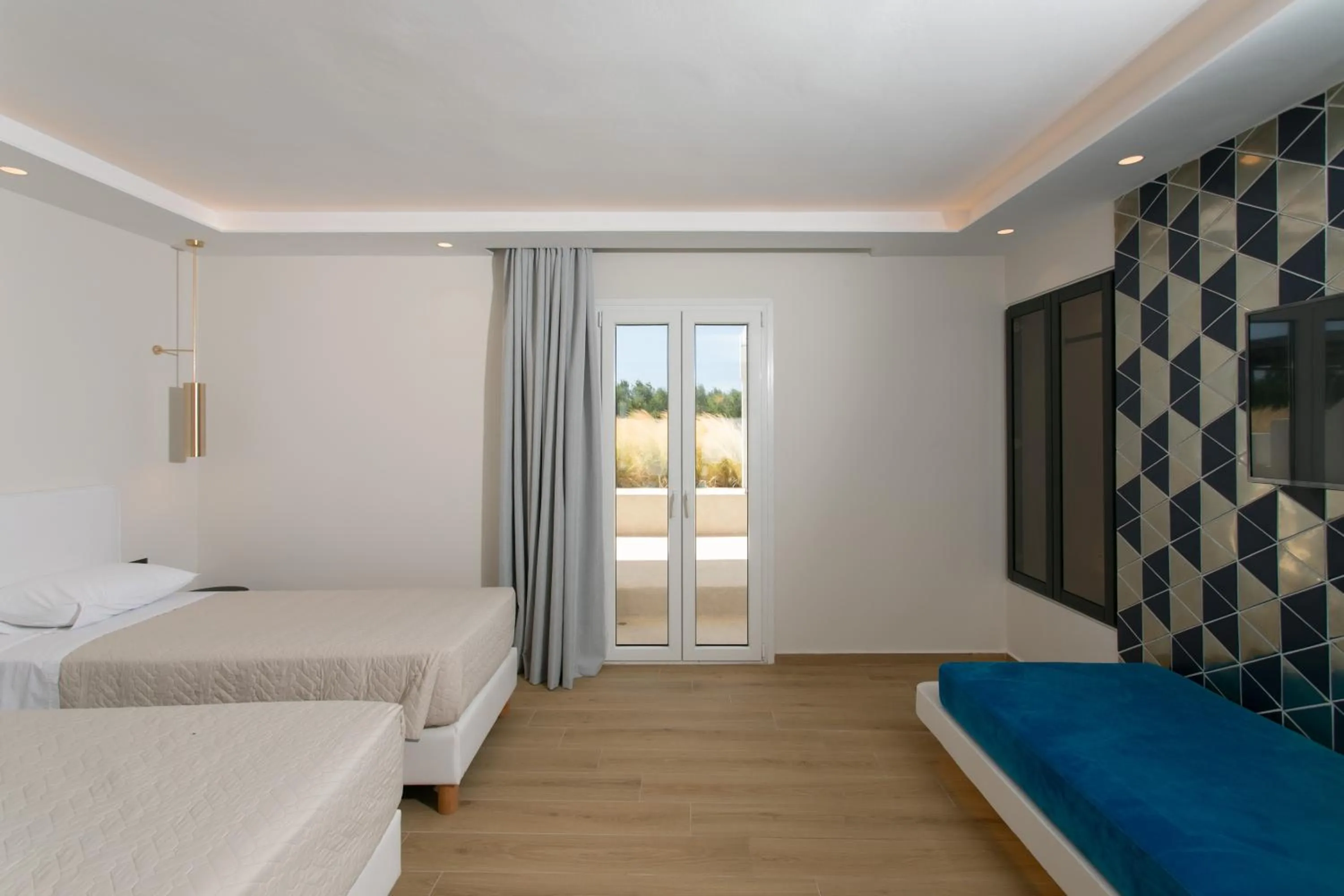 Bed in Iphimedeia Luxury Hotel & Suites