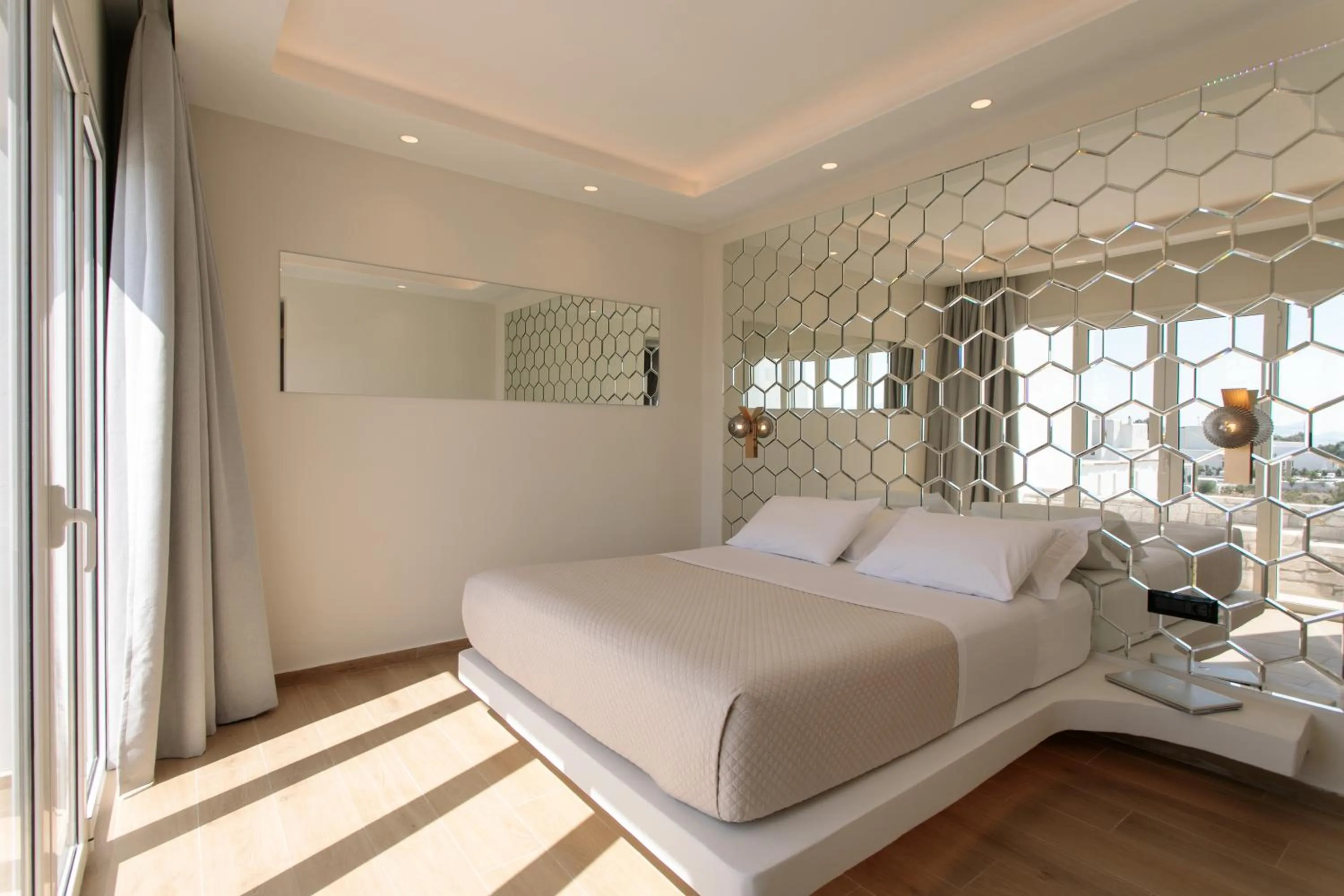 Bed in Iphimedeia Luxury Hotel & Suites