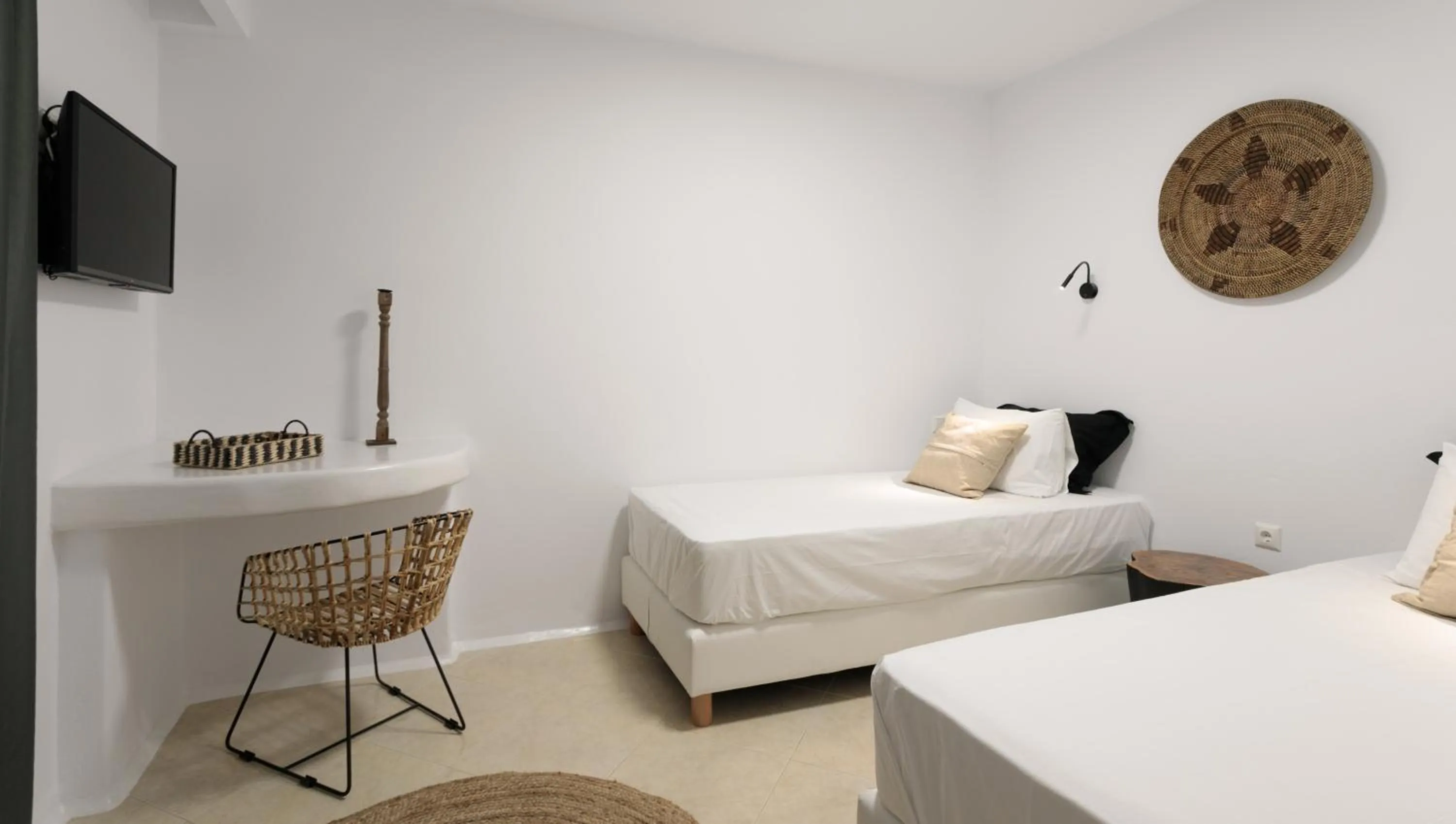 Bed in Iphimedeia Luxury Hotel & Suites