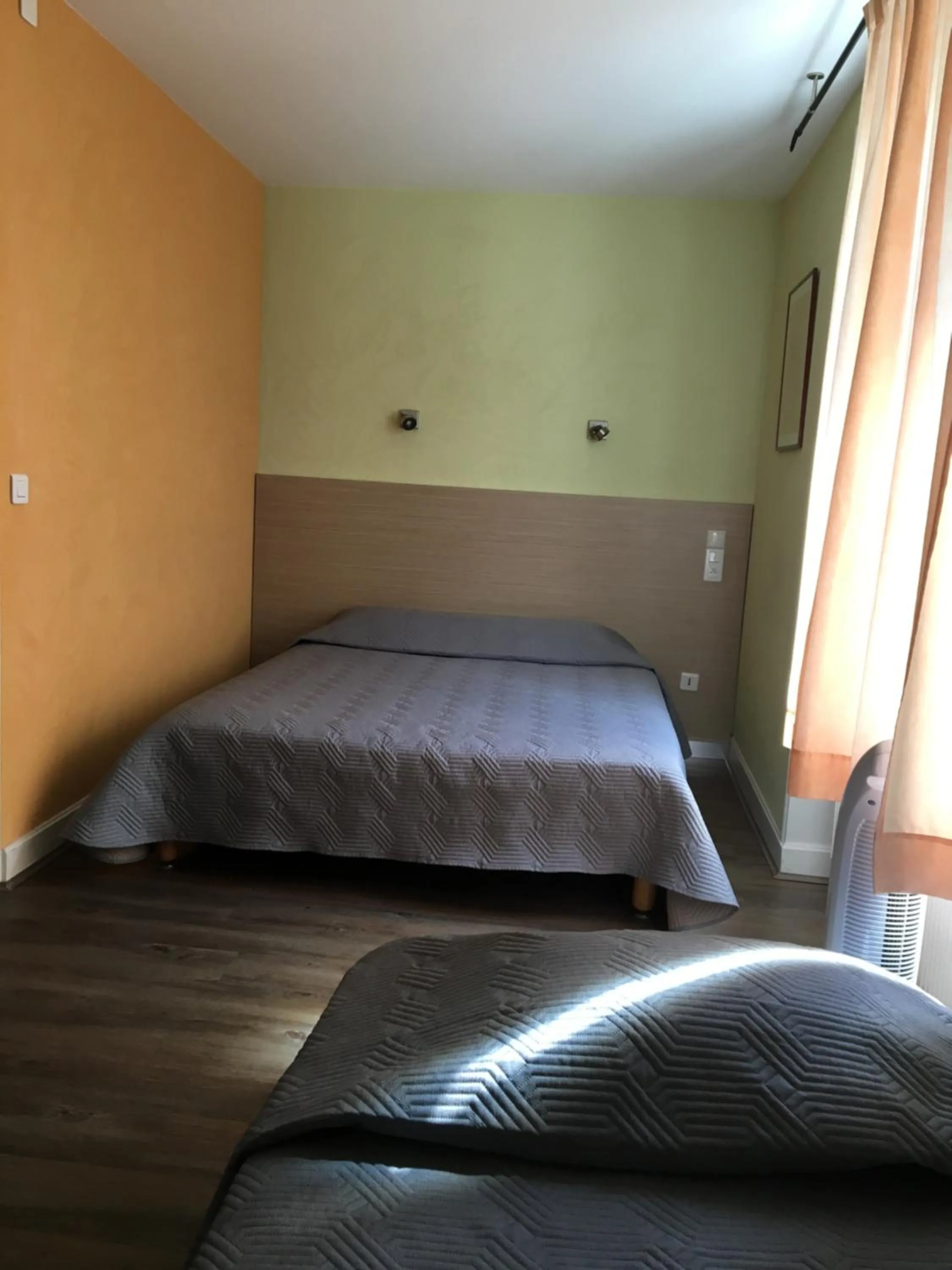 Bed in Hotel Val De Saone Lyon Caluire Rillieux