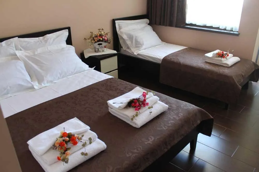 Photo of the whole room, Bed in GNS Hotel