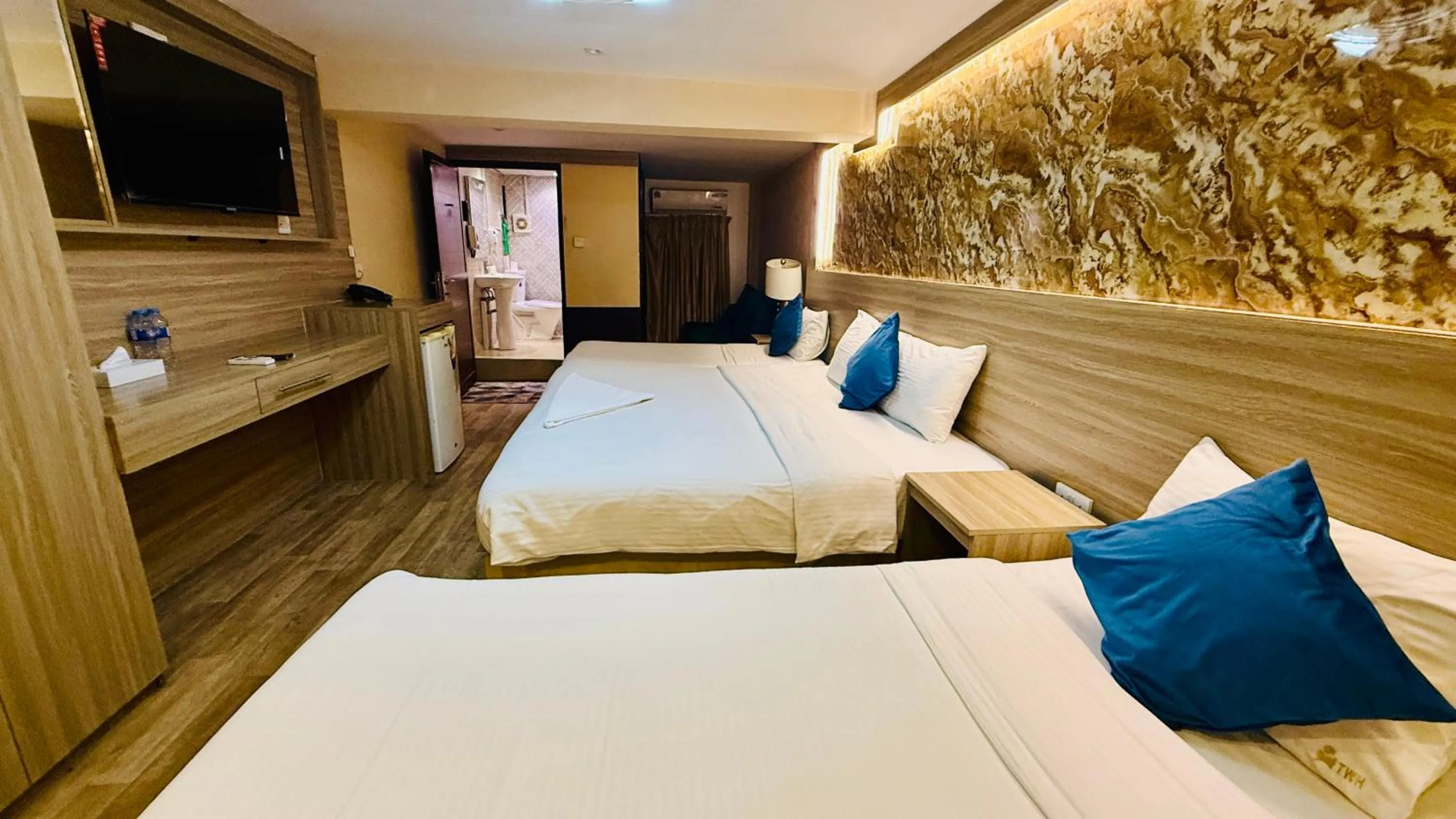 Bed in Trans World Hotel