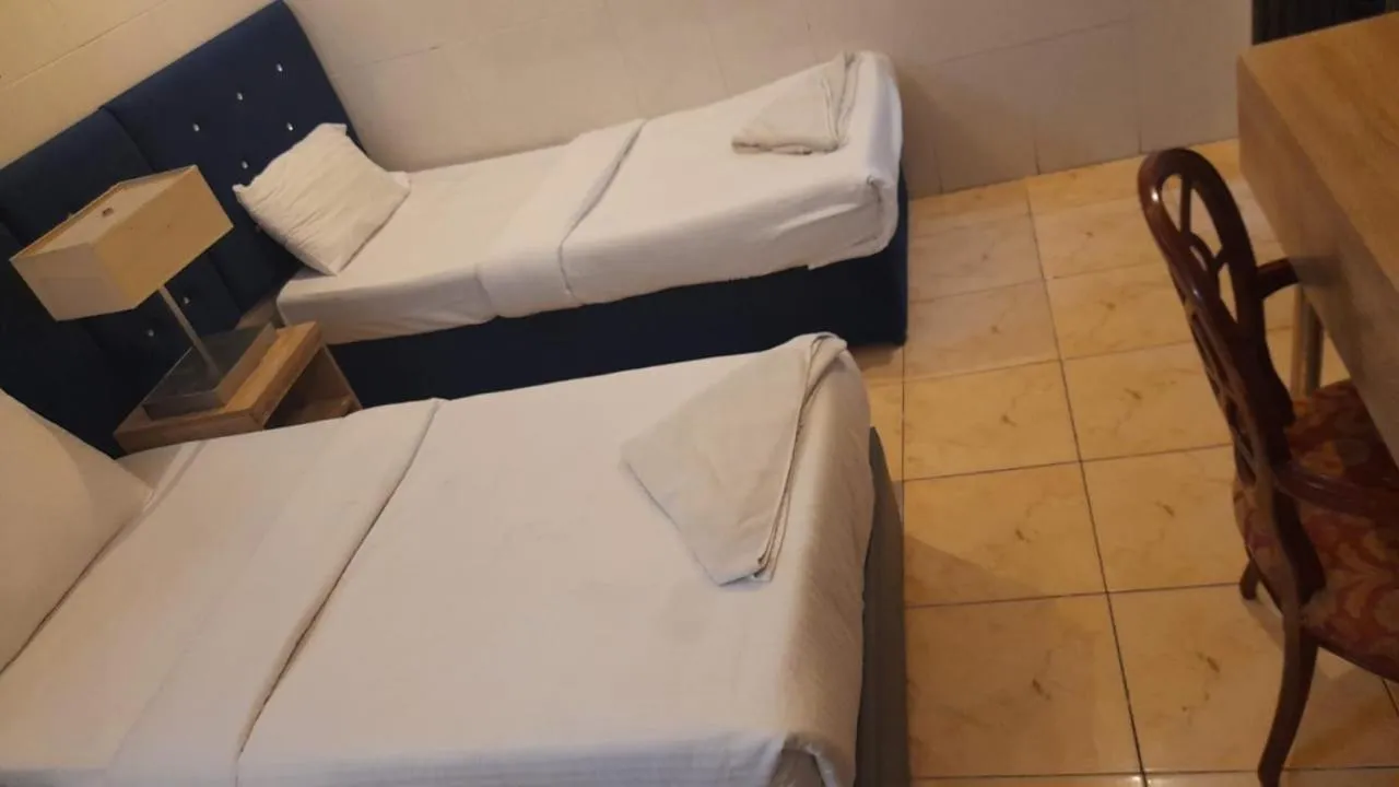 Bed in Trans World Hotel