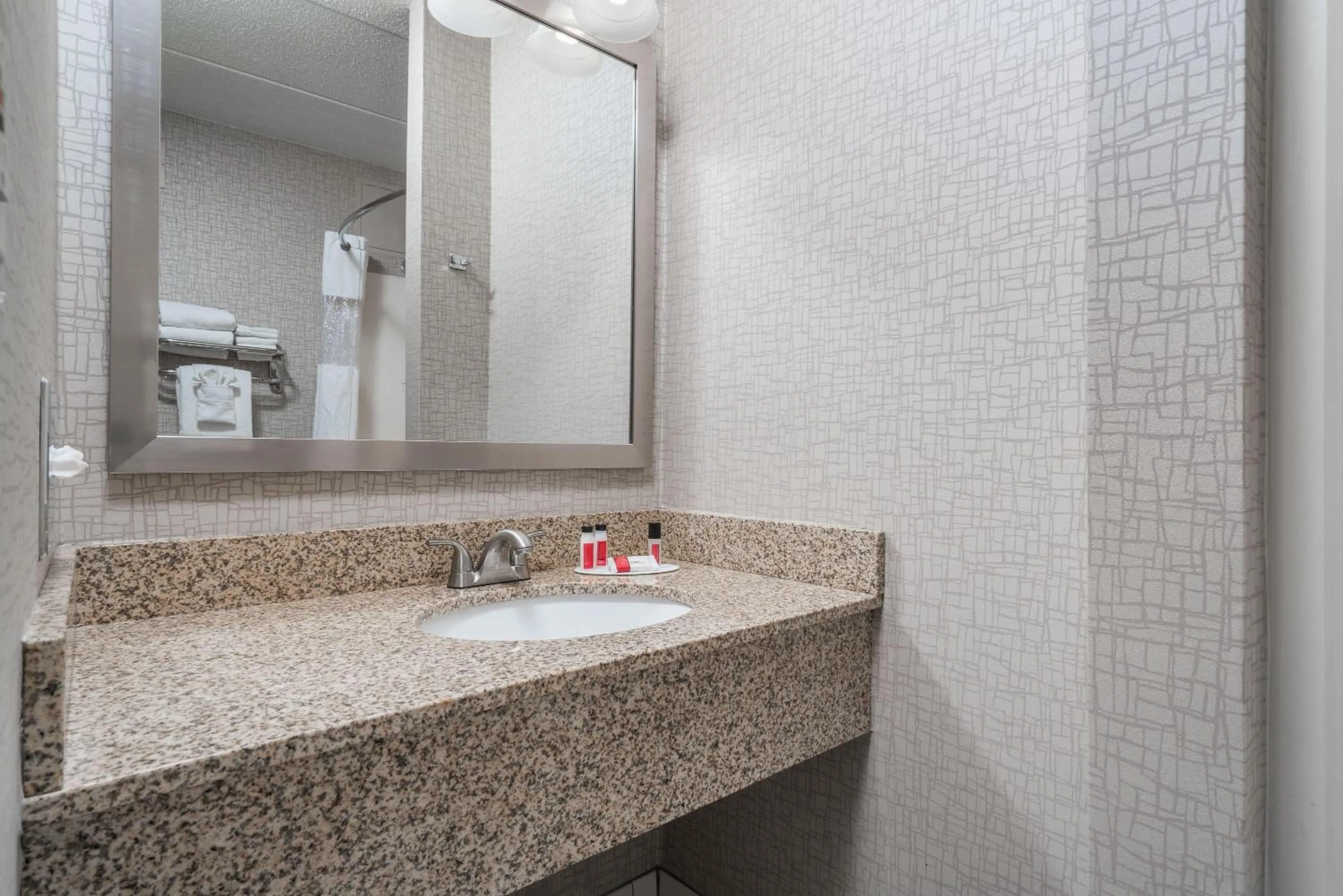 Bathroom in Days Hotel by Wyndham University Ave SE