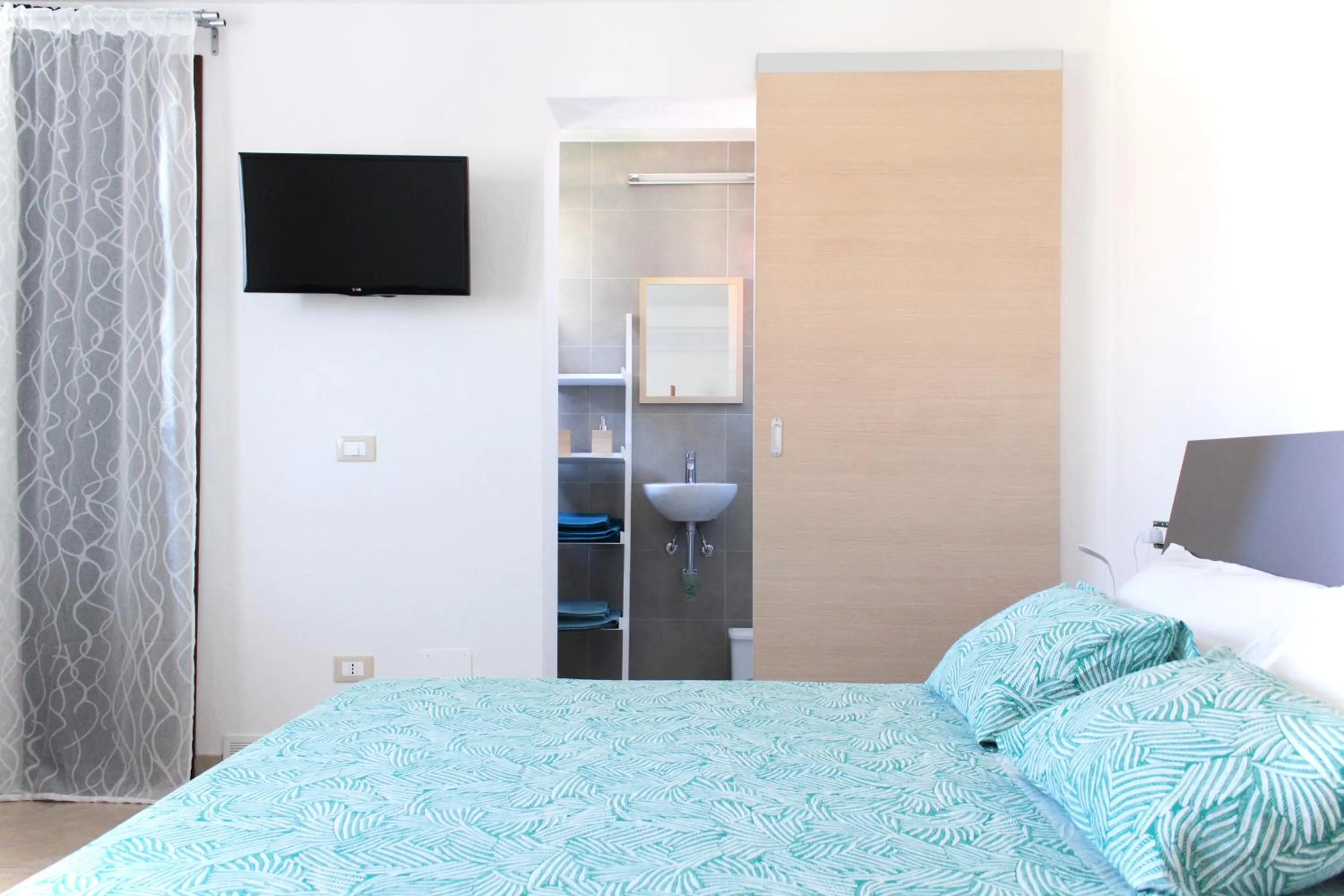 Bed in Acquachiara Rooms