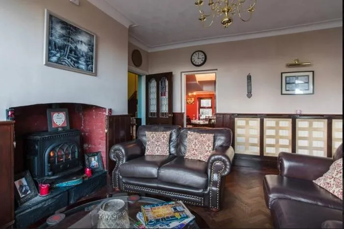 Communal lounge/ TV room in Ty Mynydd Lodge