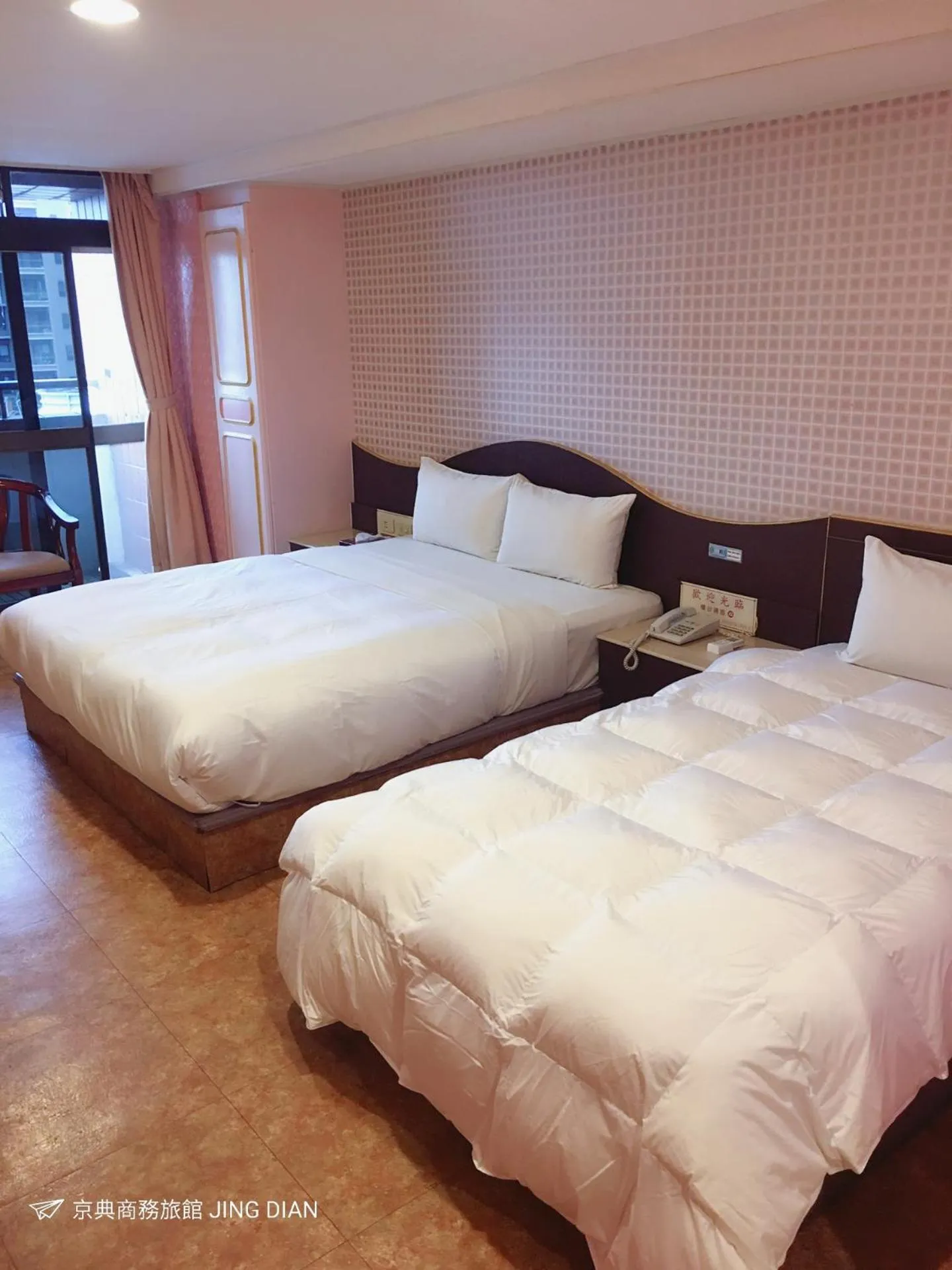 Bed in Jing Dian Business Hotel