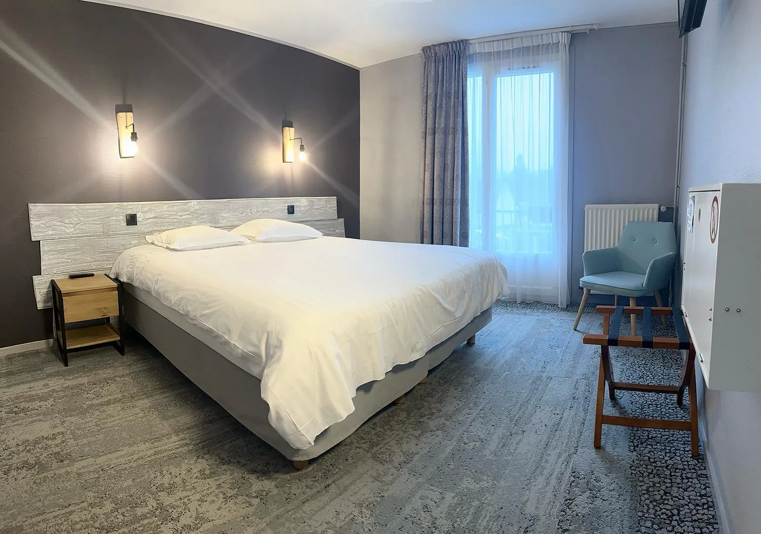 Bed in Hôtel de l'Ours