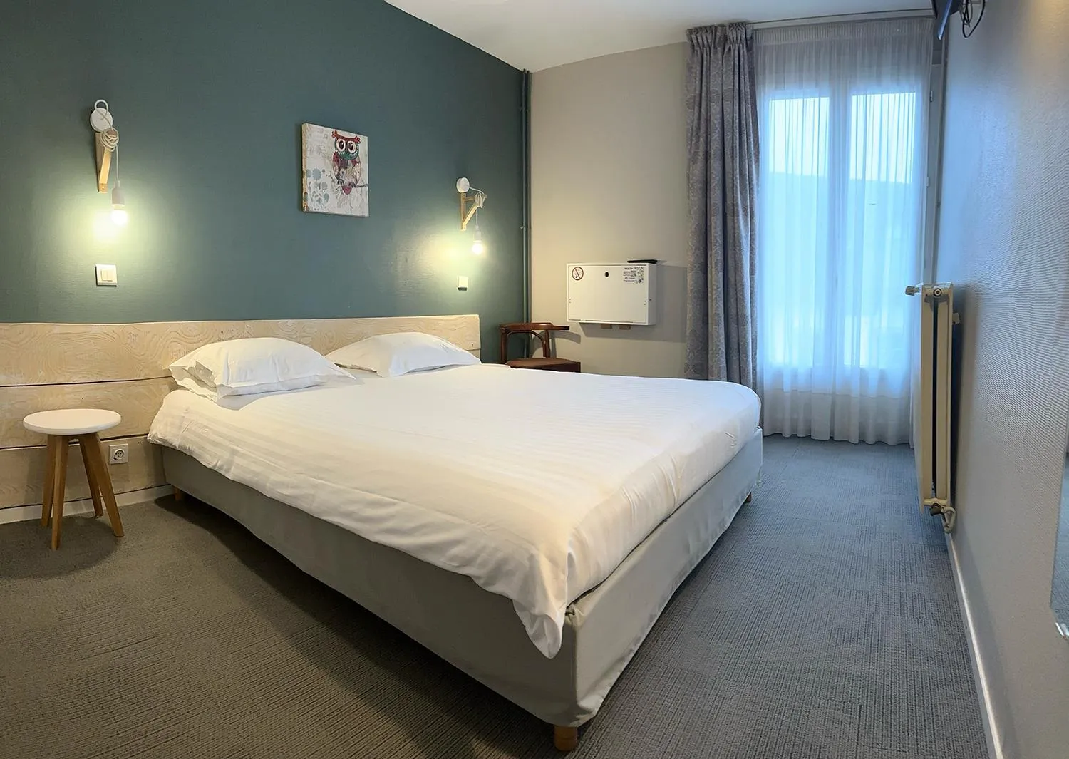 Bed in Hôtel de l'Ours