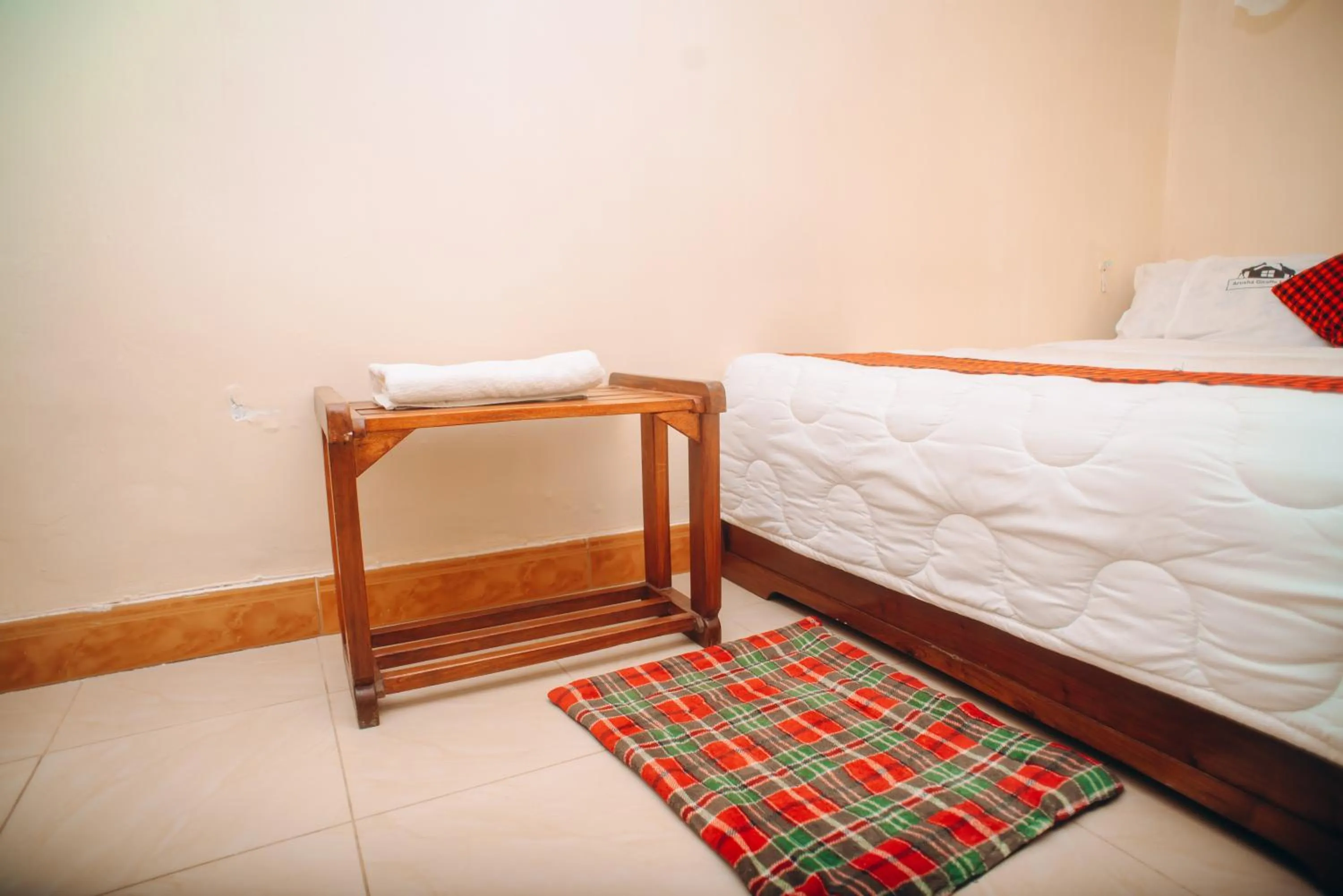 Bed in Arusha Giraffe Lodge