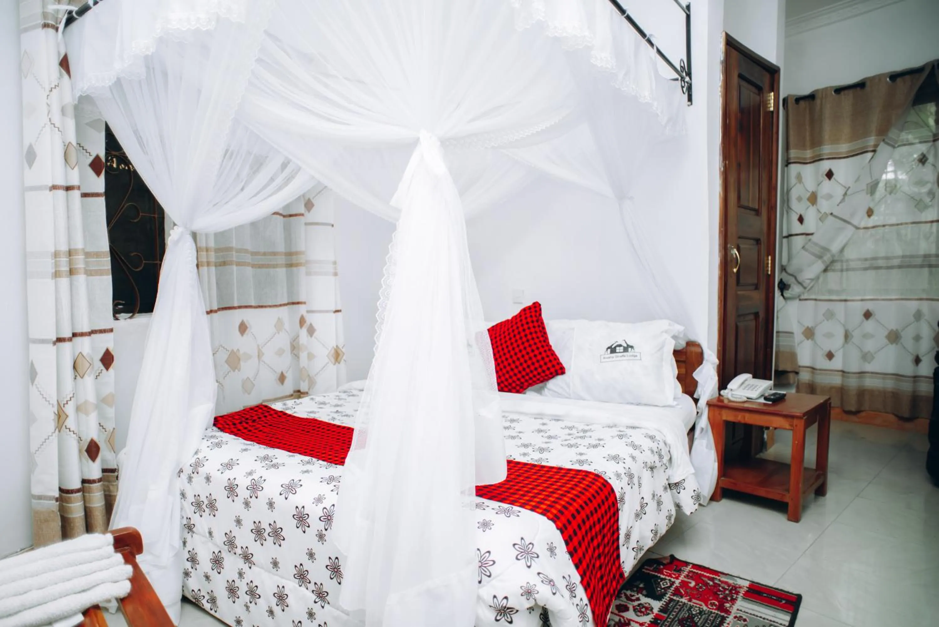 Bed in Arusha Giraffe Lodge