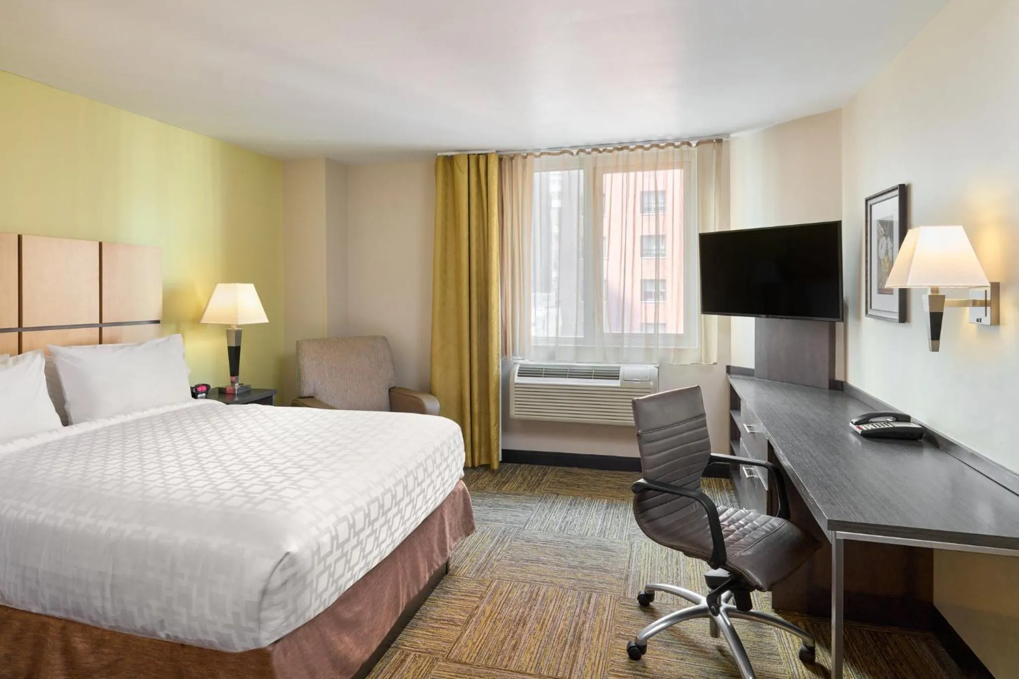Photo of the whole room, Bed in Candlewood Suites NYC -Times Square by IHG