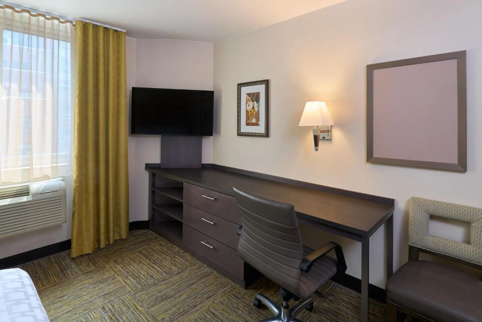Photo of the whole room, Bed in Candlewood Suites NYC -Times Square by IHG