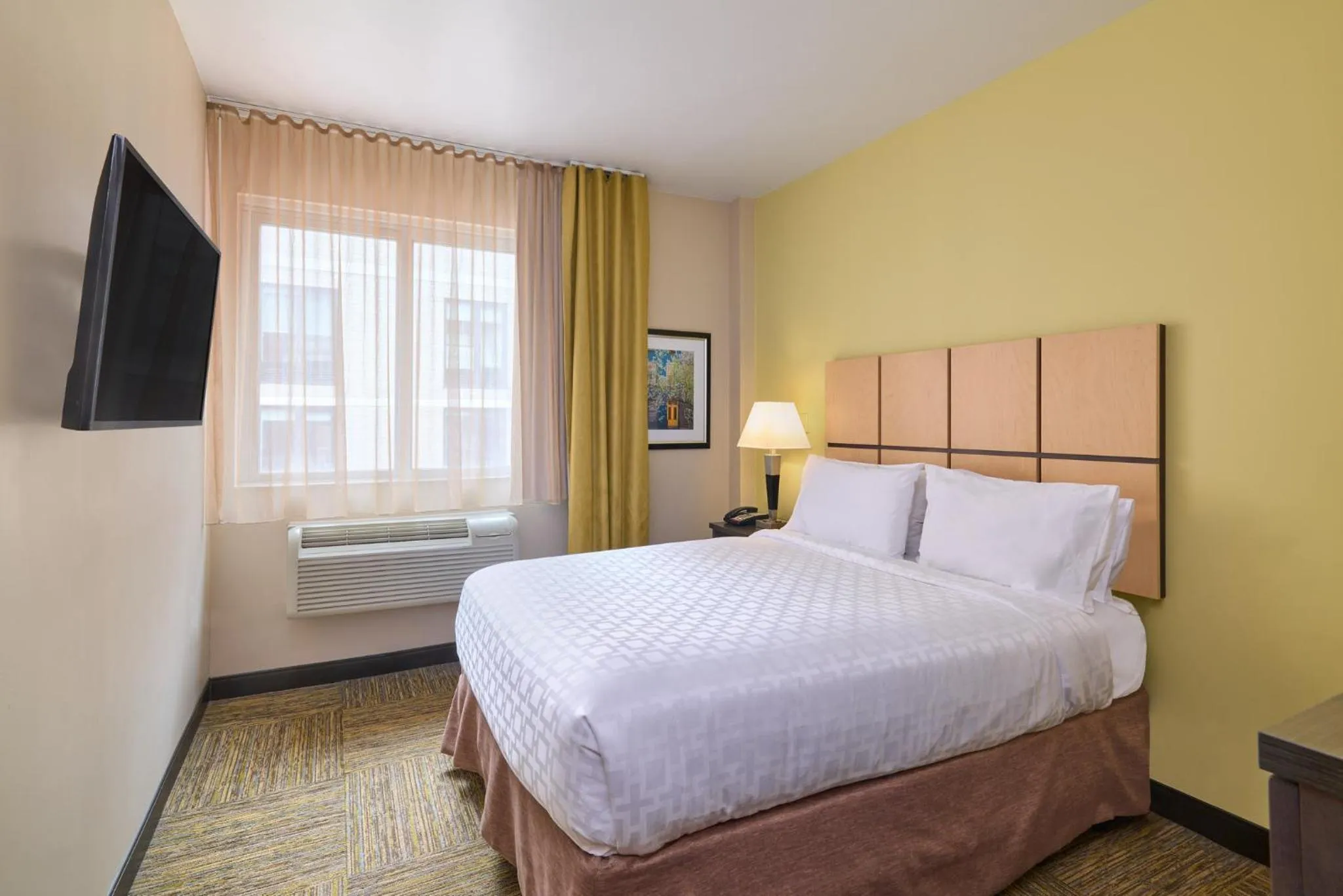 Photo of the whole room, Bed in Candlewood Suites NYC -Times Square by IHG