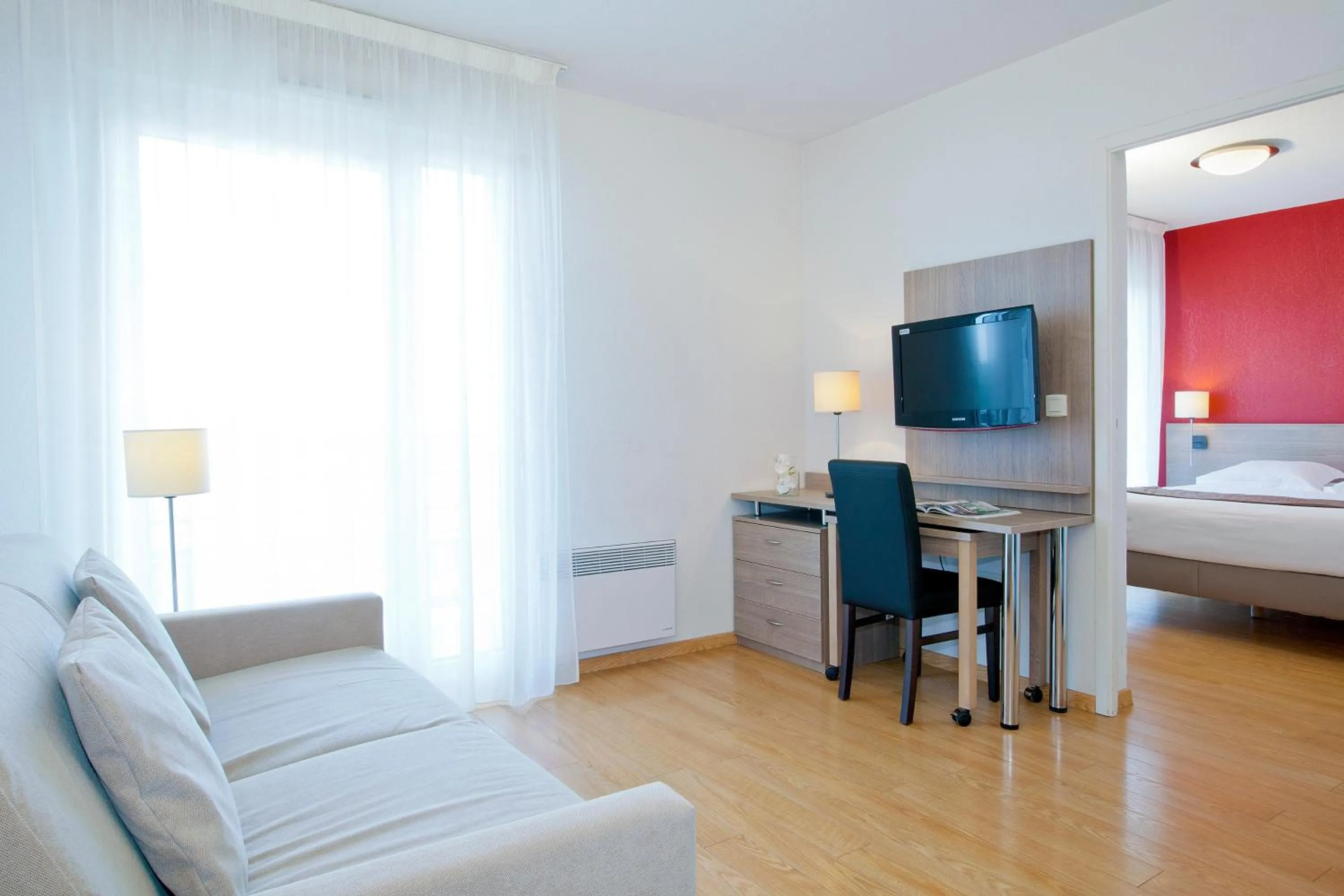 Living room, Bed in Séjours & Affaires Genève Gex Les Rives Du Léman