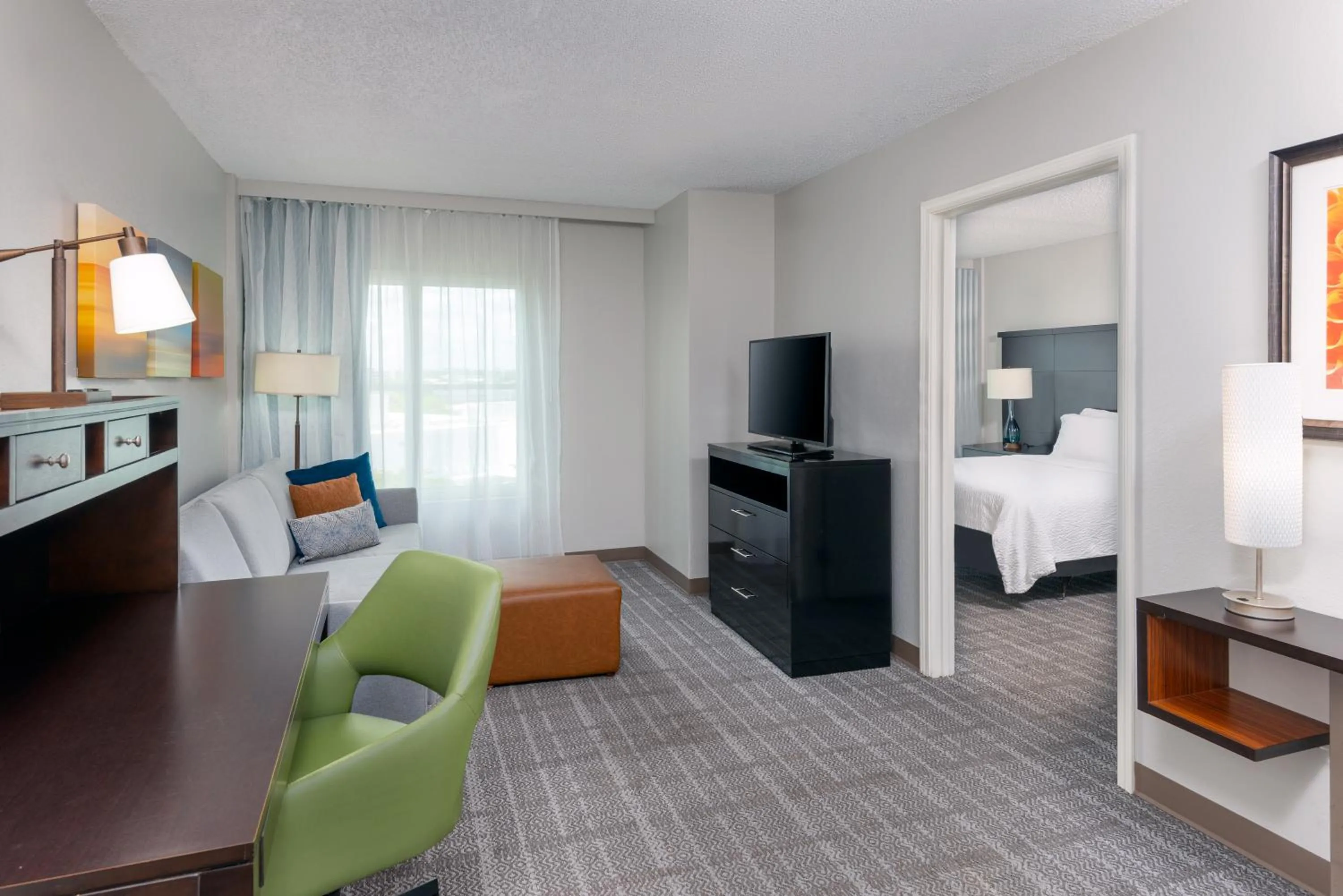 Living room, Bed in Staybridge Suites Miami Doral Area by IHG