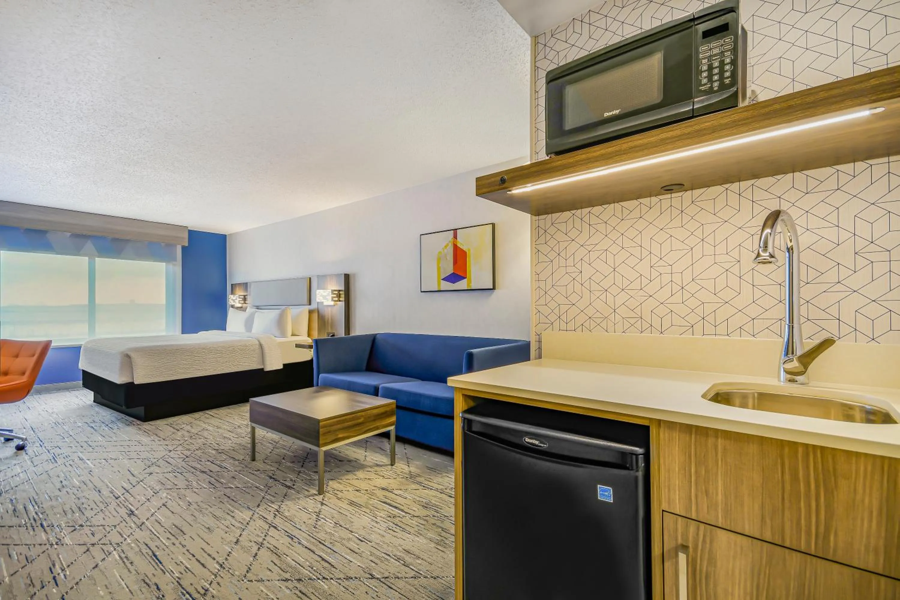 Living room, Bed in Holiday Inn Express & Suites Buffalo Airport by IHG