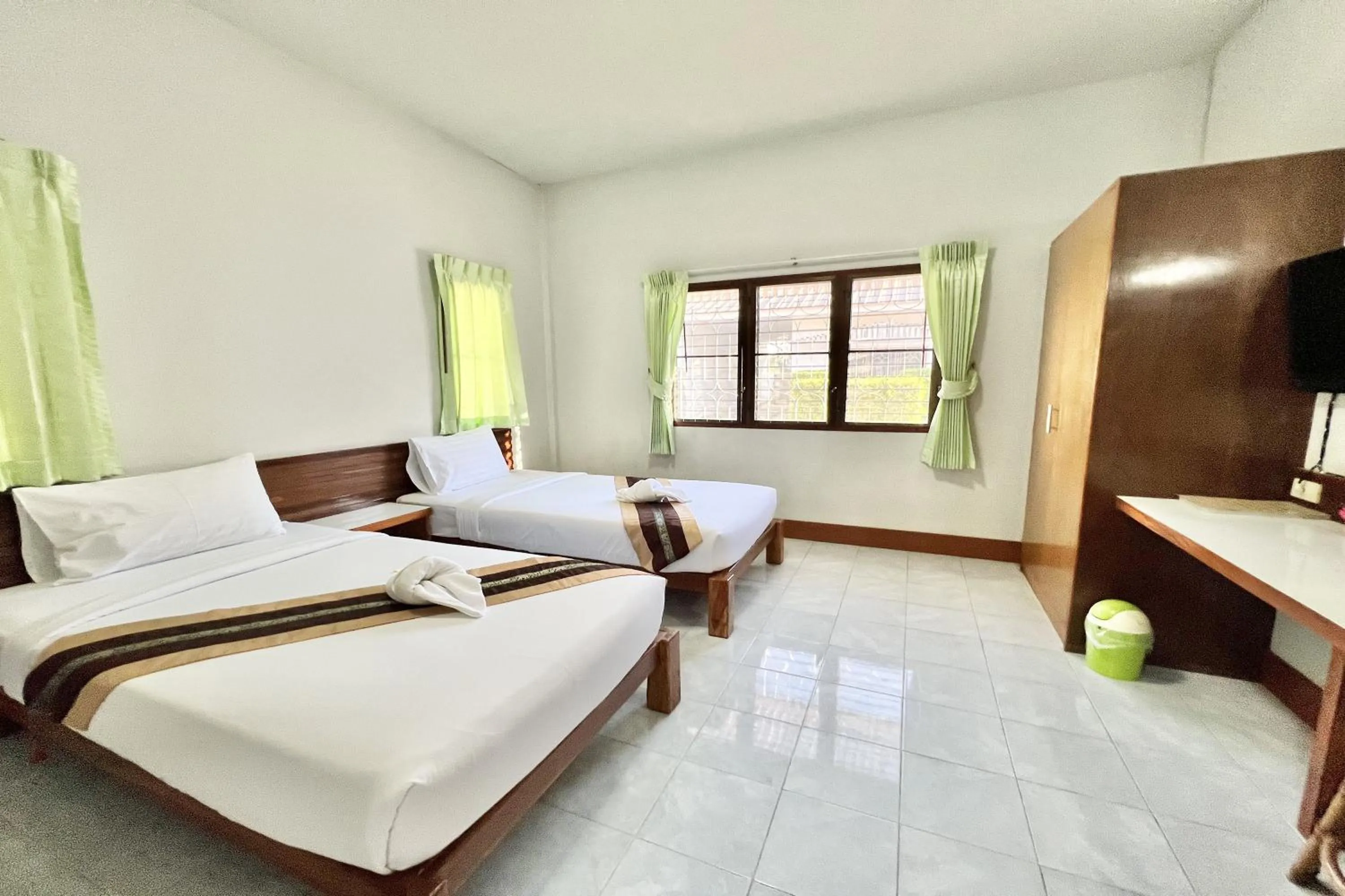 Bed in Ruentara Resort & Villa
