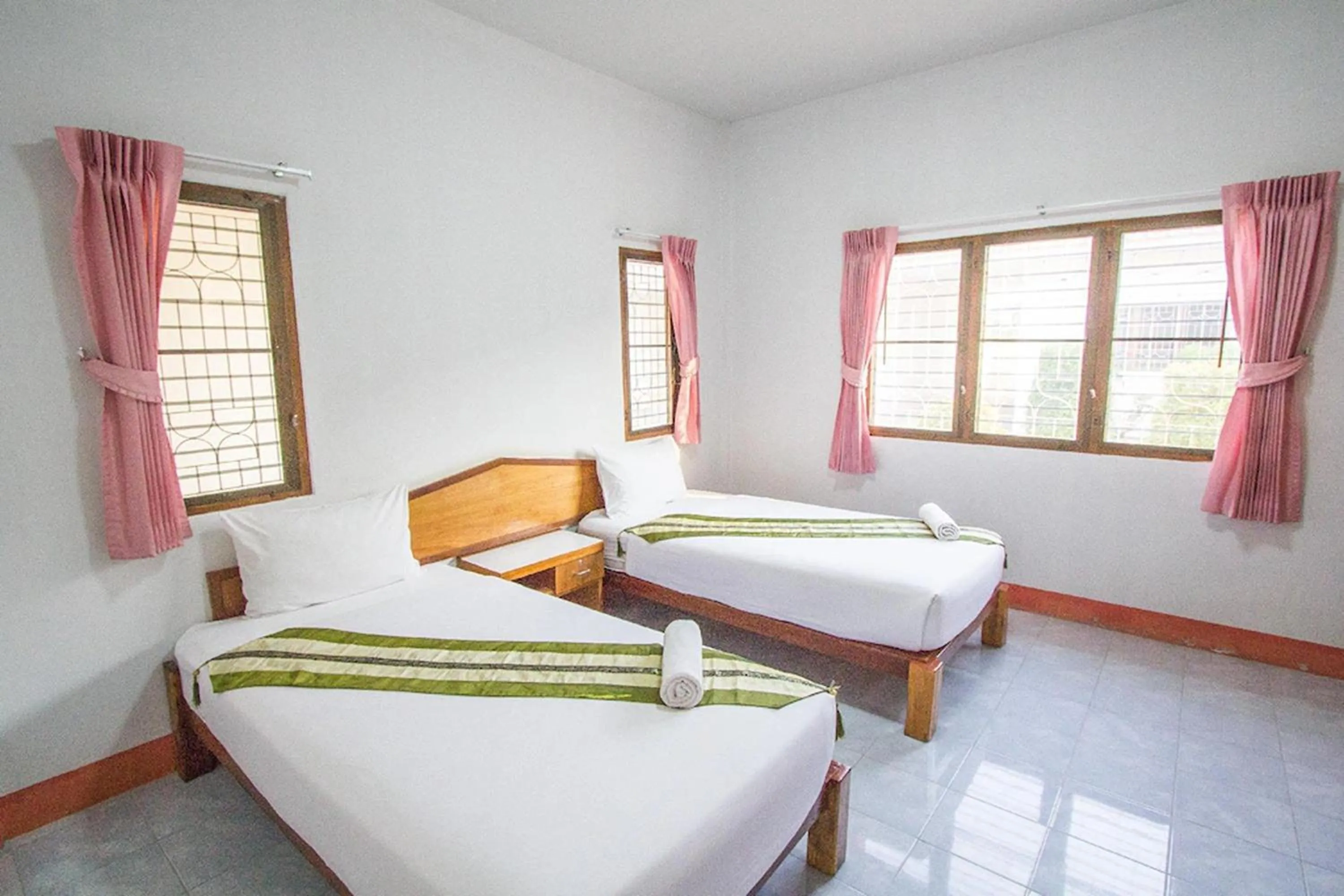 Bed in Ruentara Resort & Villa
