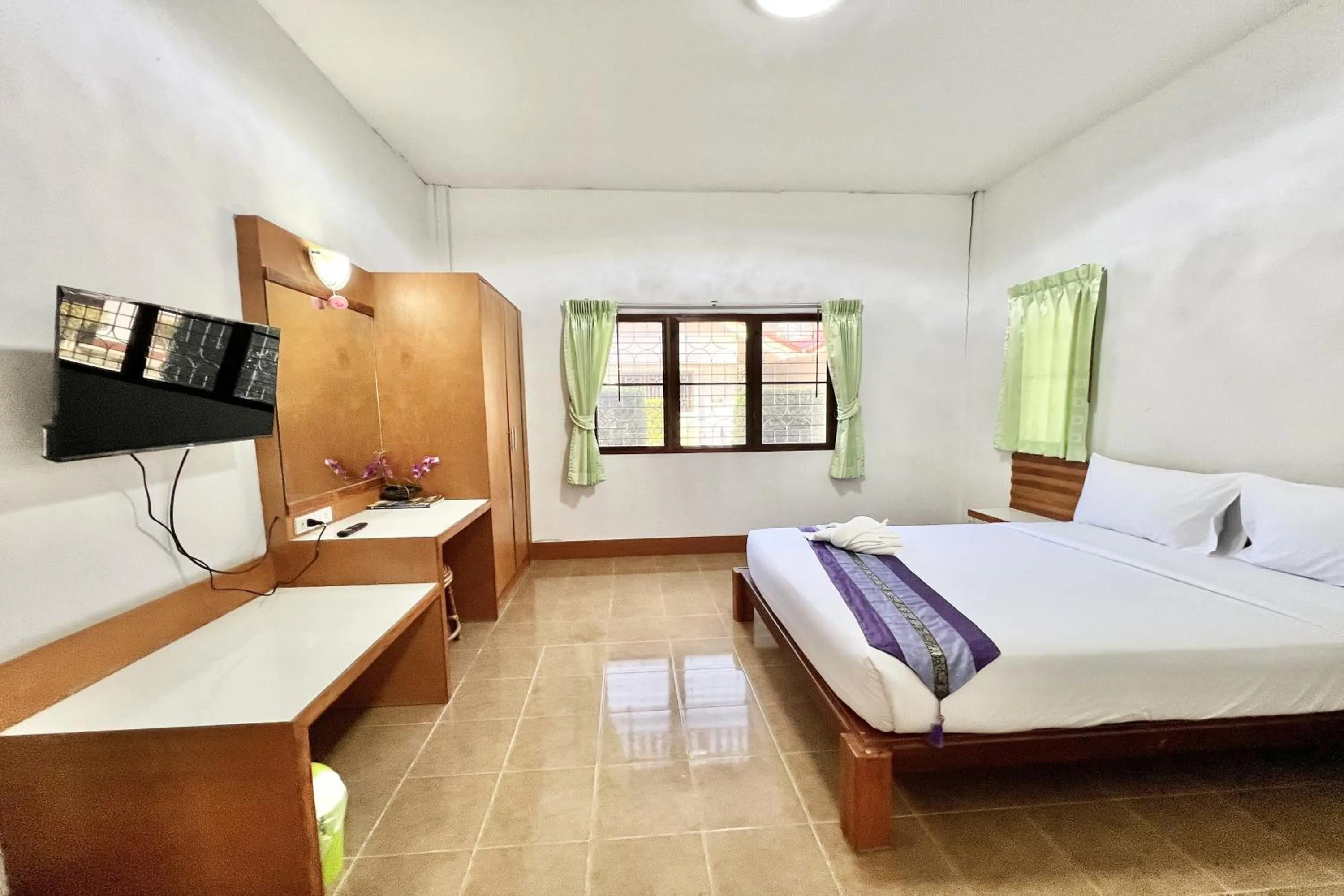 Bed in Ruentara Resort & Villa