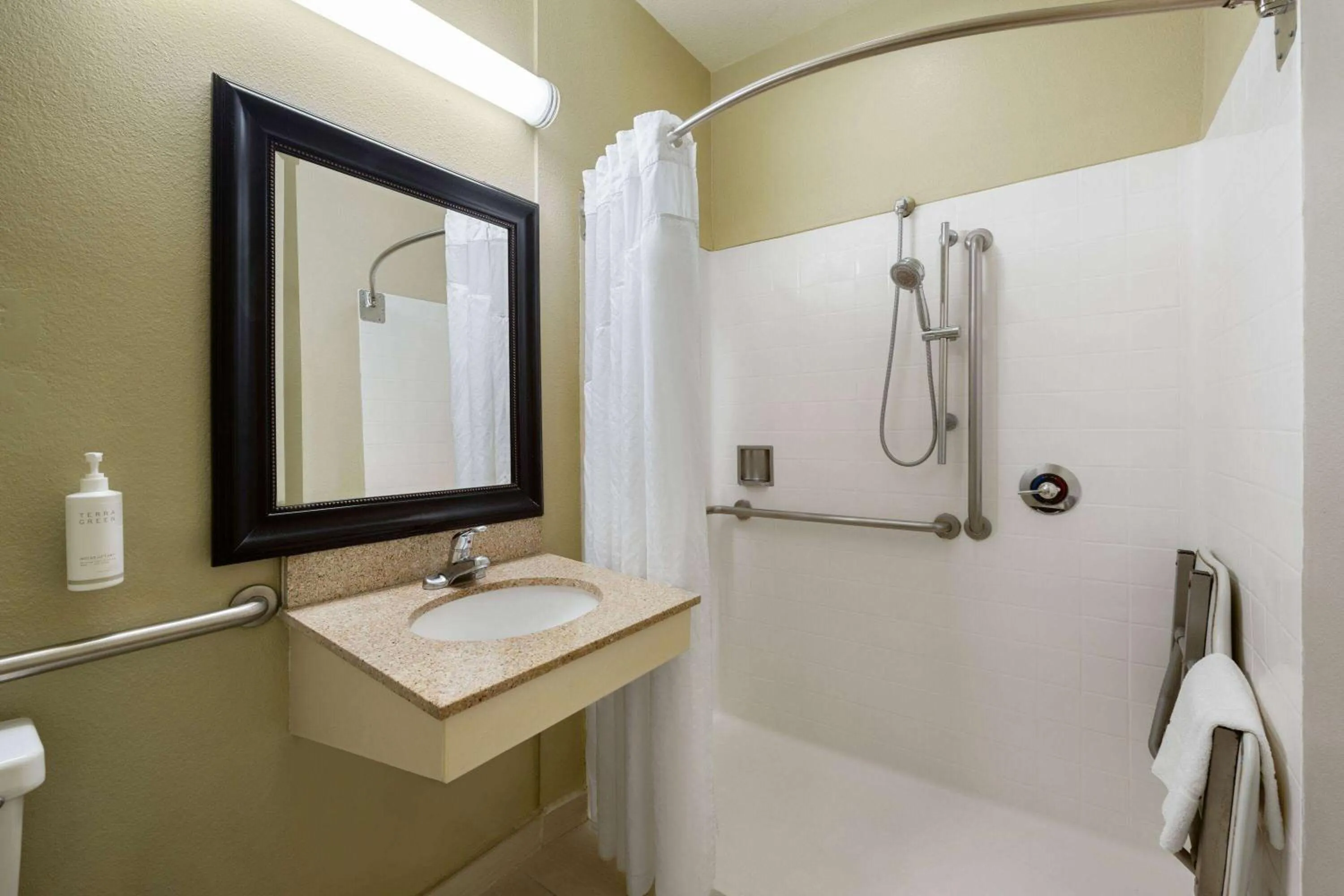 Shower in Hotel Marguerite South Anaheim - Garden Grove, Trademark Collection by Wyndham