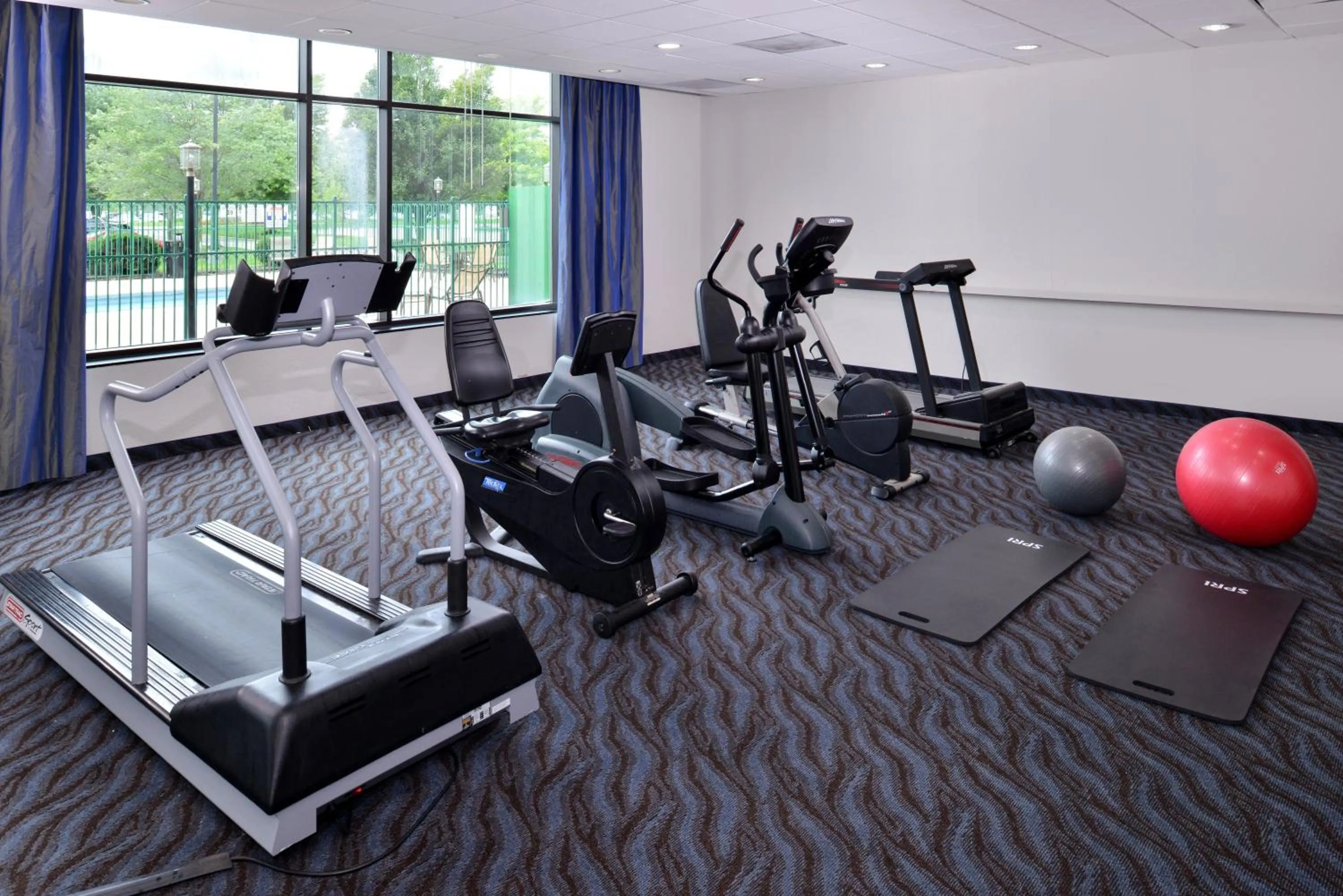Fitness centre/facilities in Elimwood Hotel, a Ramada by Wyndham