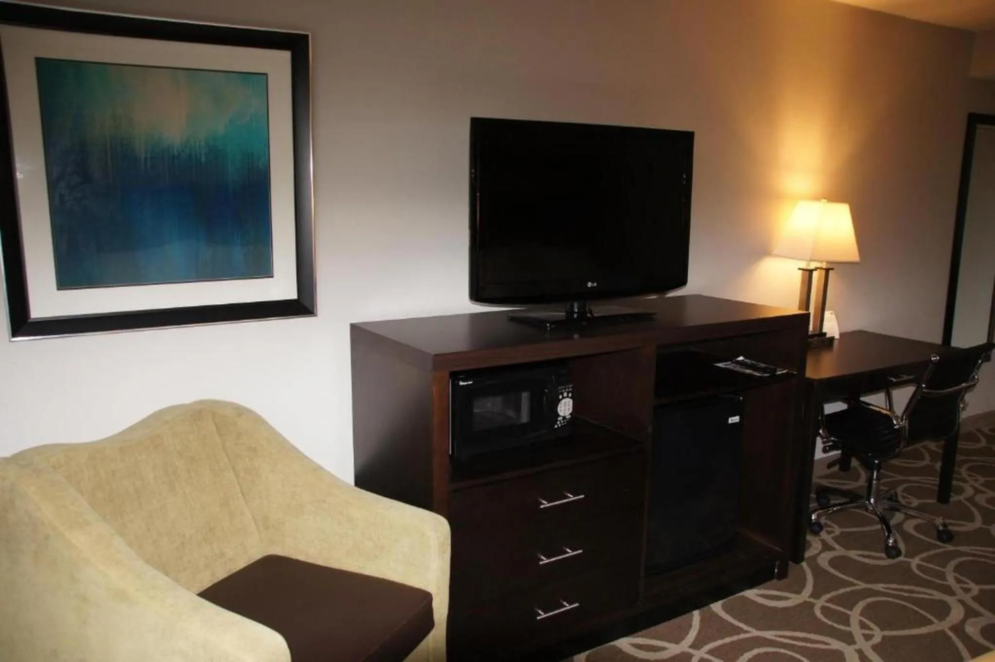 Bedroom in Elimwood Hotel, a Ramada by Wyndham