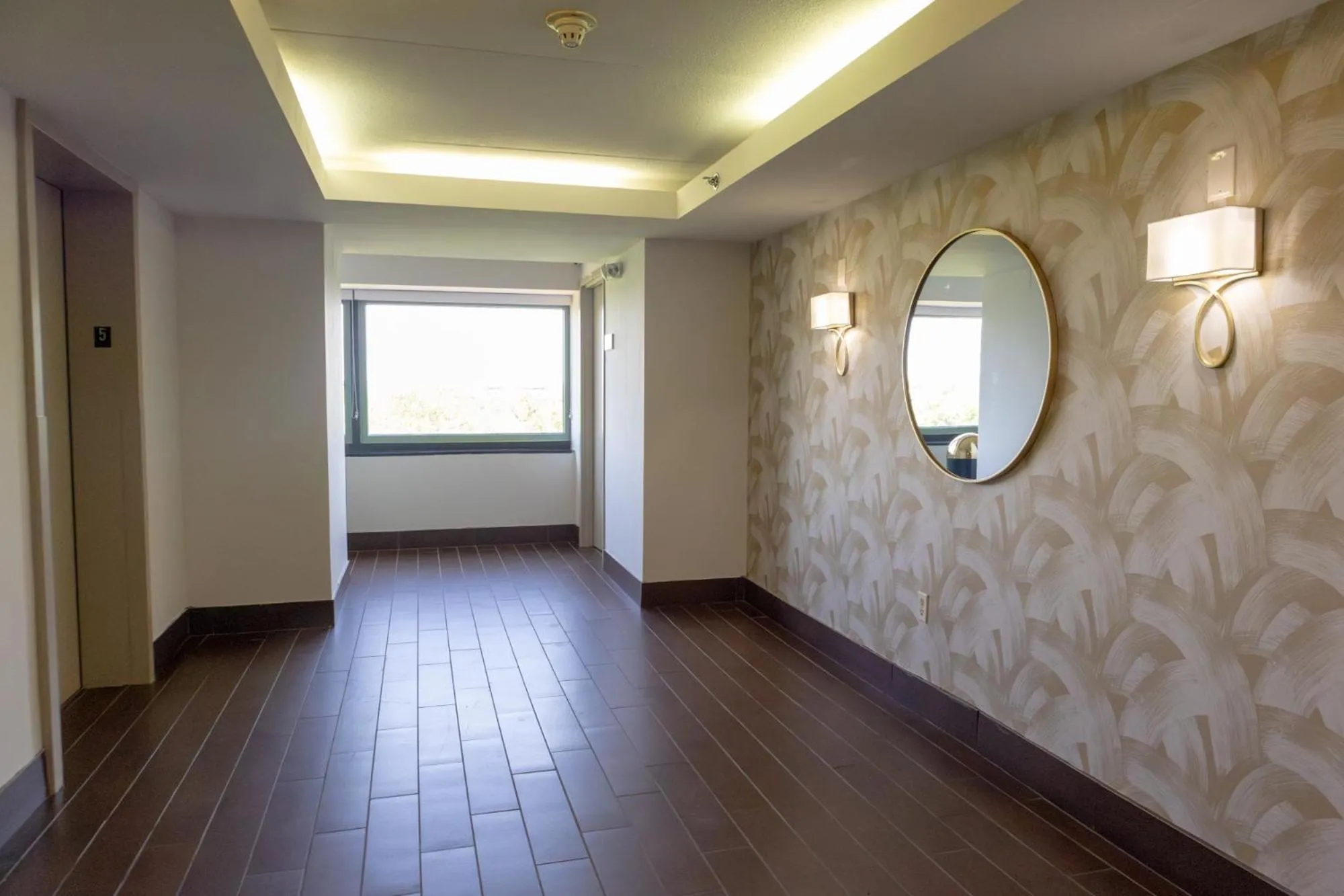 elevator in Elimwood Hotel, a Ramada by Wyndham