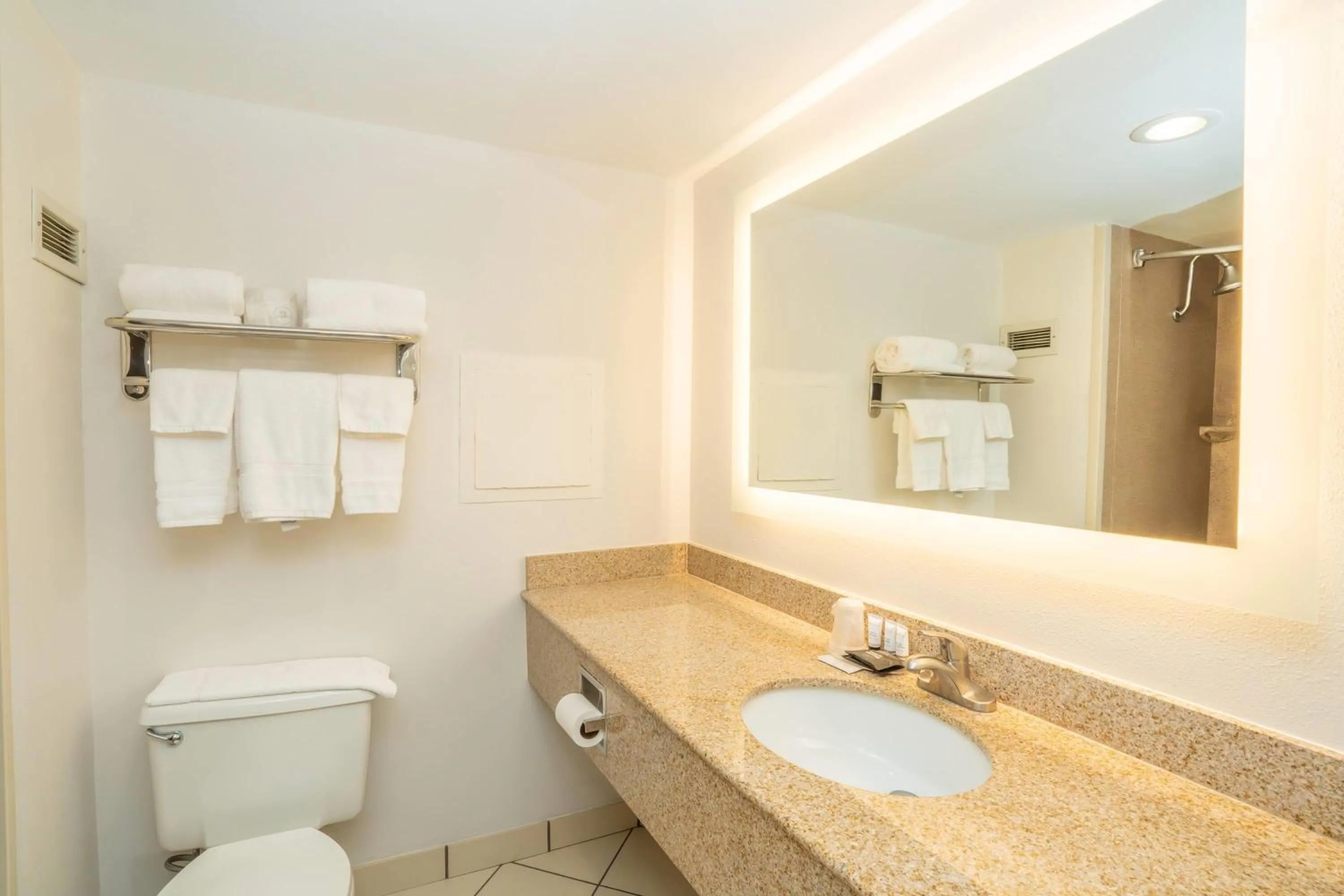 Bathroom in Elimwood Hotel, a Ramada by Wyndham