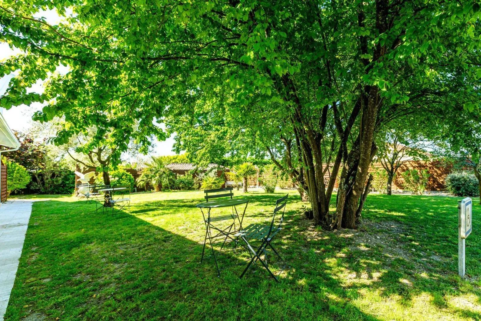 Garden in Logis Hôtel L'Oliveraie