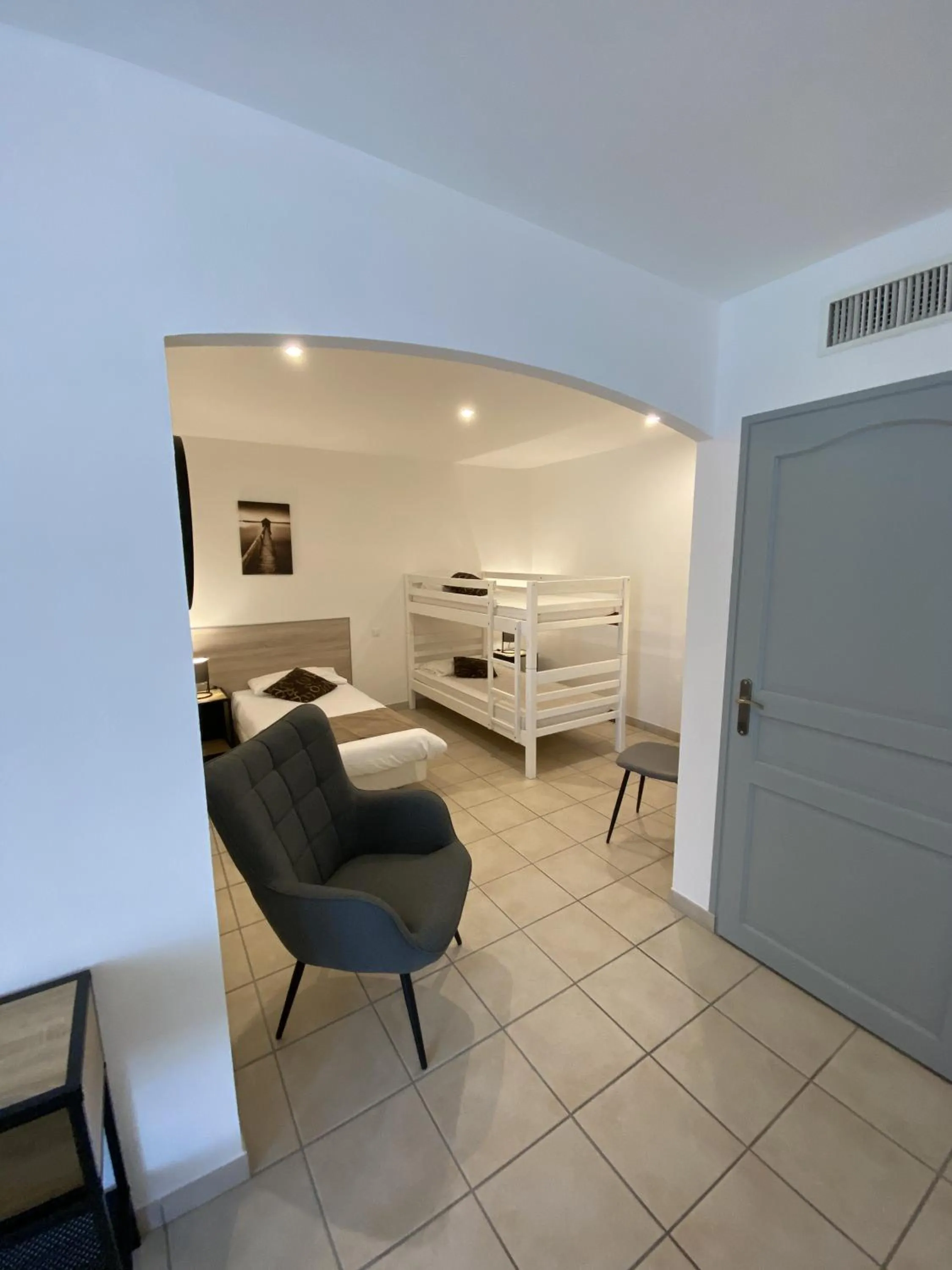 Bed in Logis Hôtel L'Oliveraie