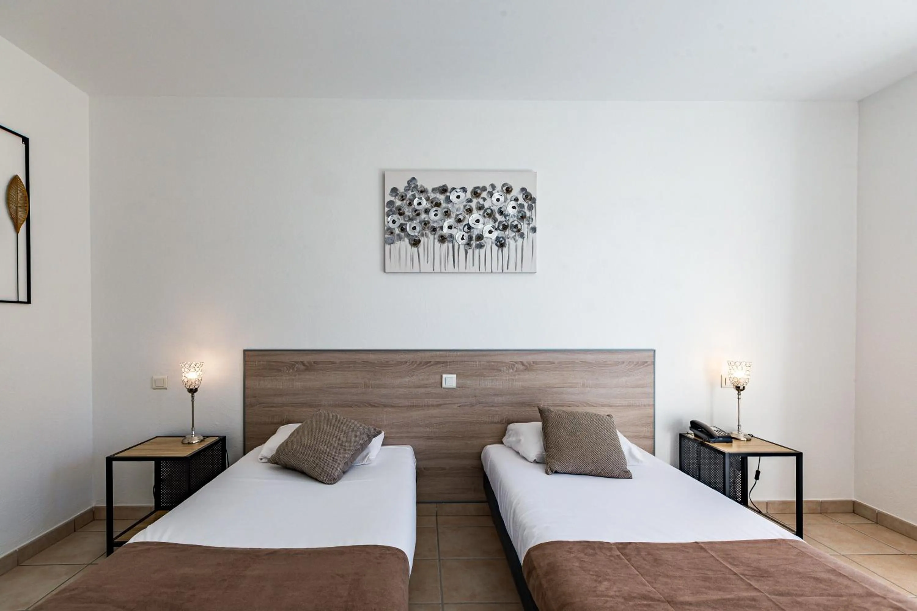 Bed in Logis Hôtel L'Oliveraie