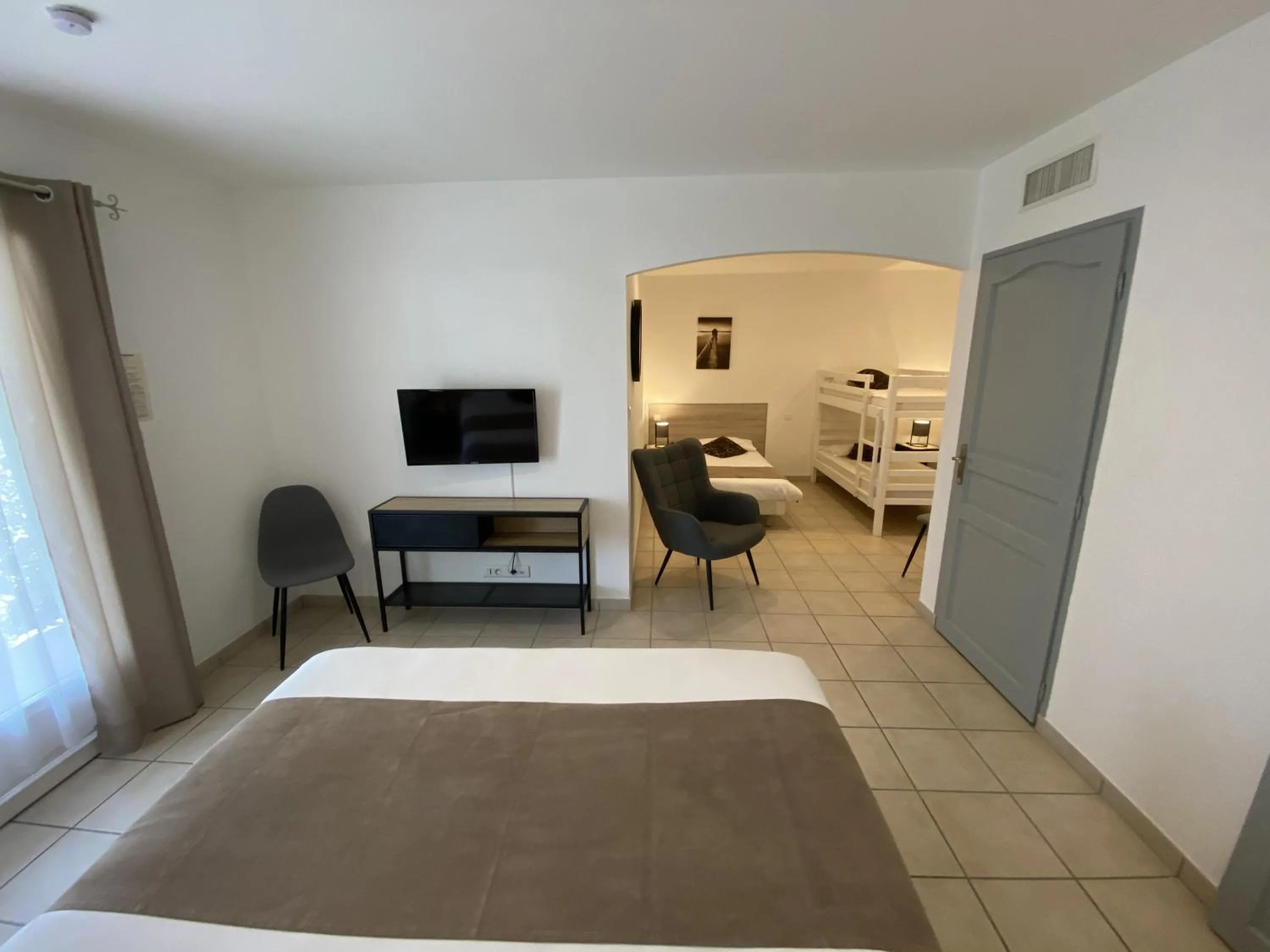 Bed in Logis Hôtel L'Oliveraie