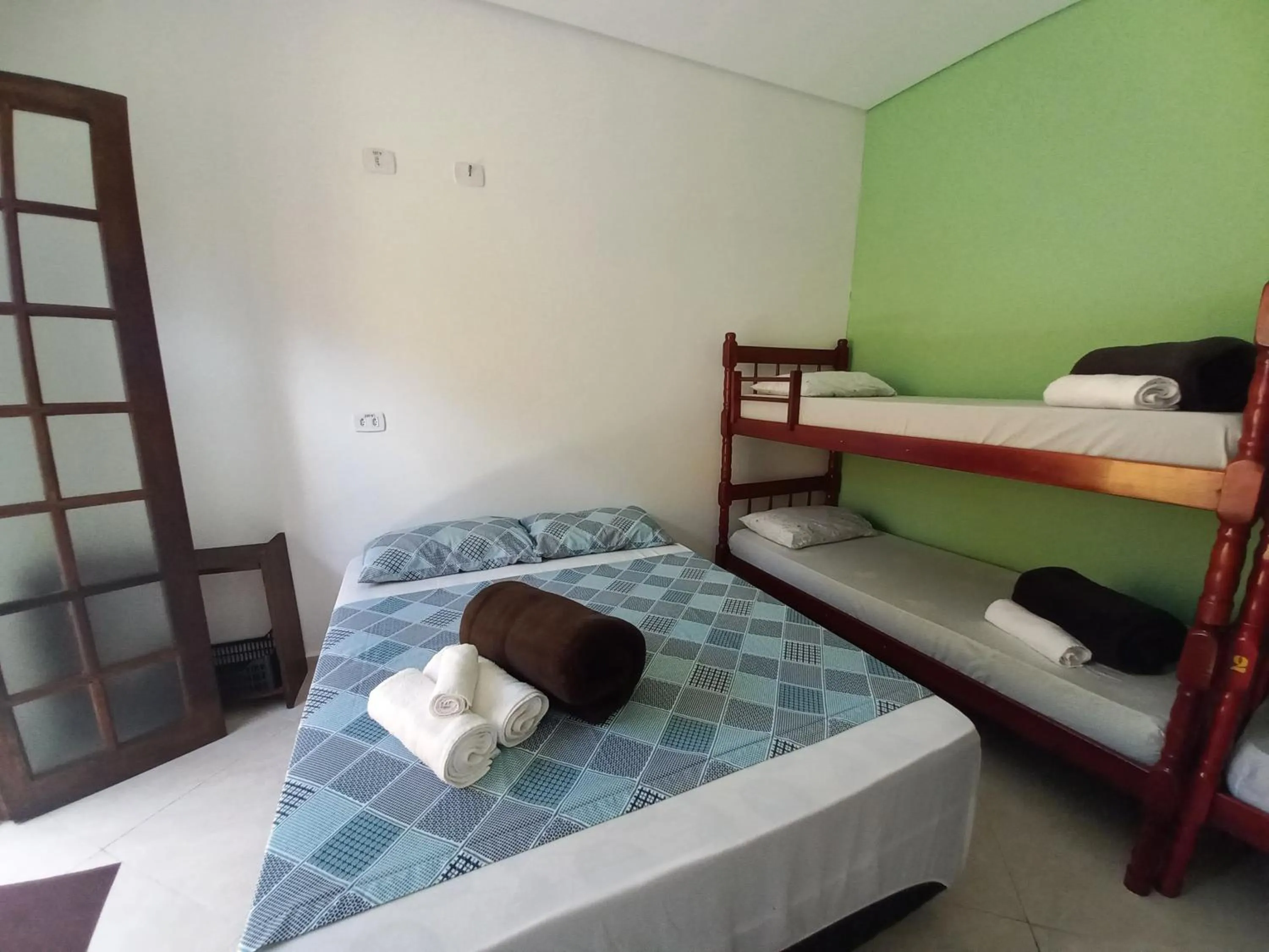 Bed in Suítes Cantinho do Sossego Ubatuba