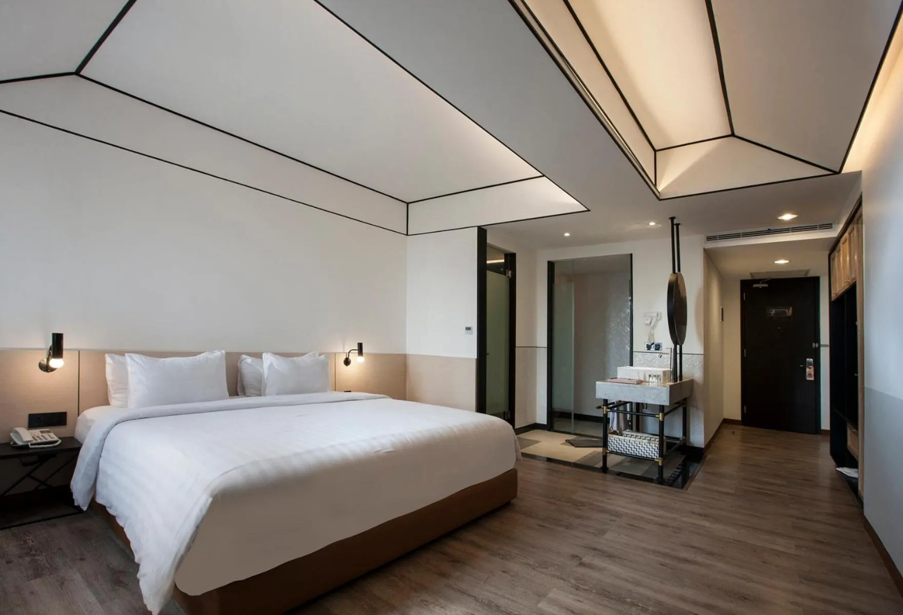 Bed in GAIA Cosmo Hotel