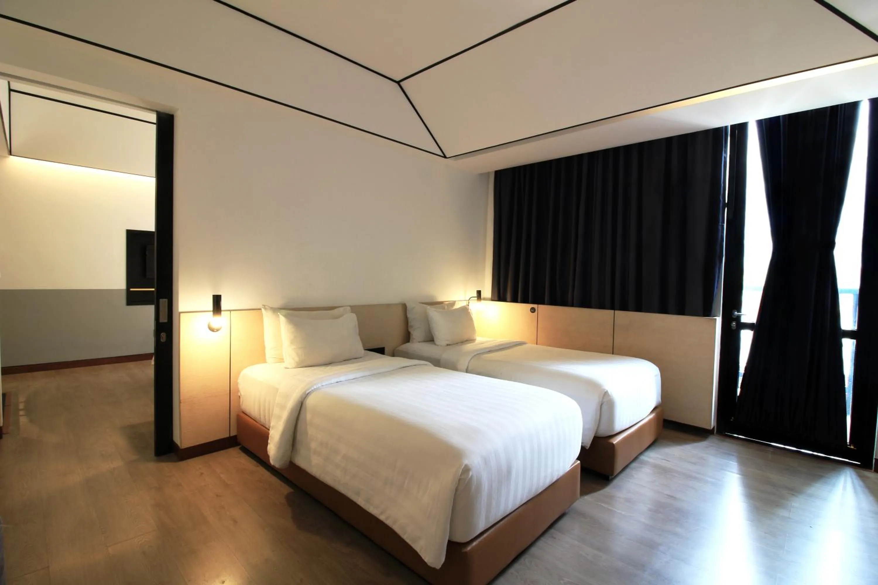 Bed in GAIA Cosmo Hotel