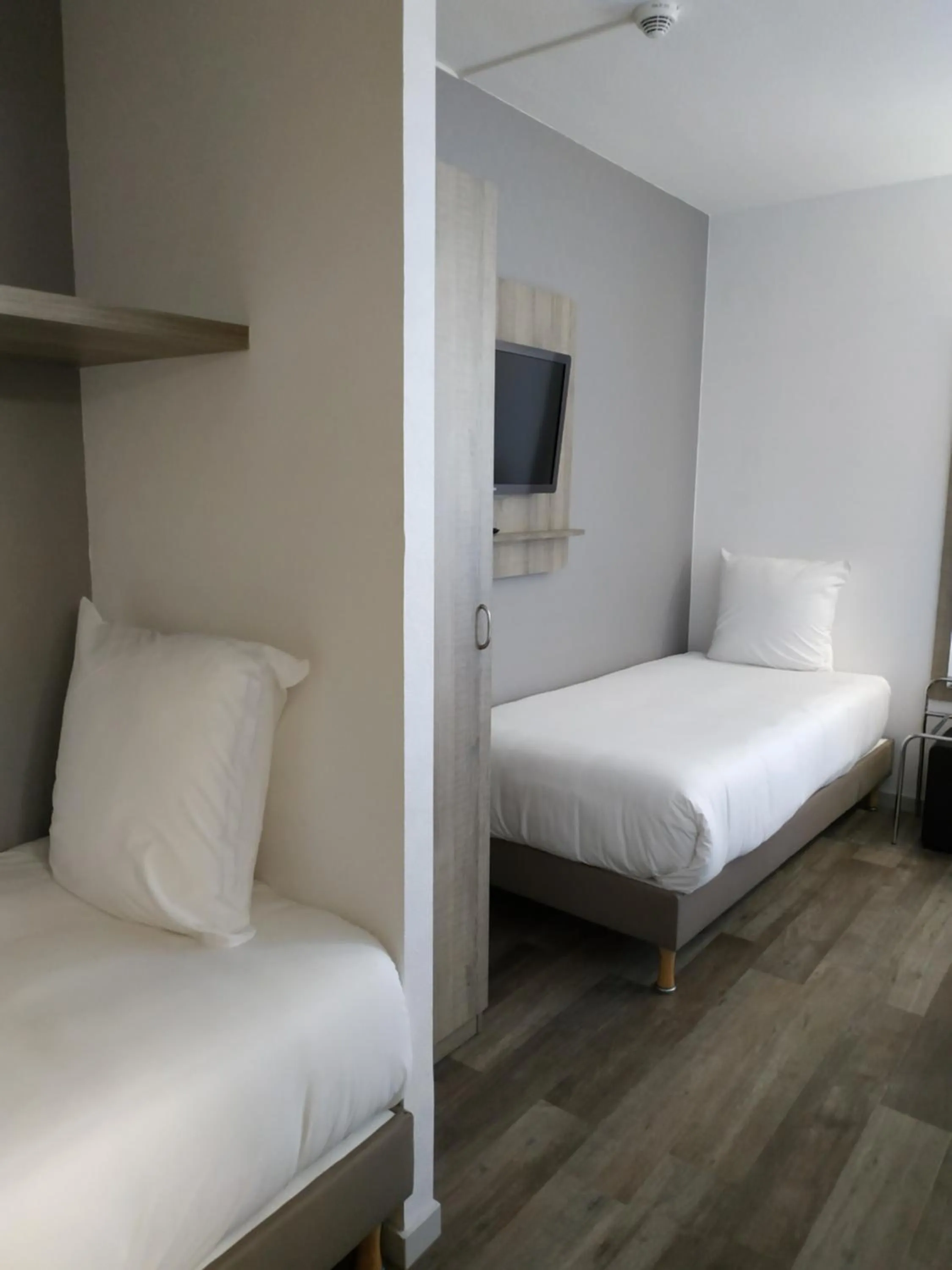 Bed in Hotel Le Circuit Le Mans