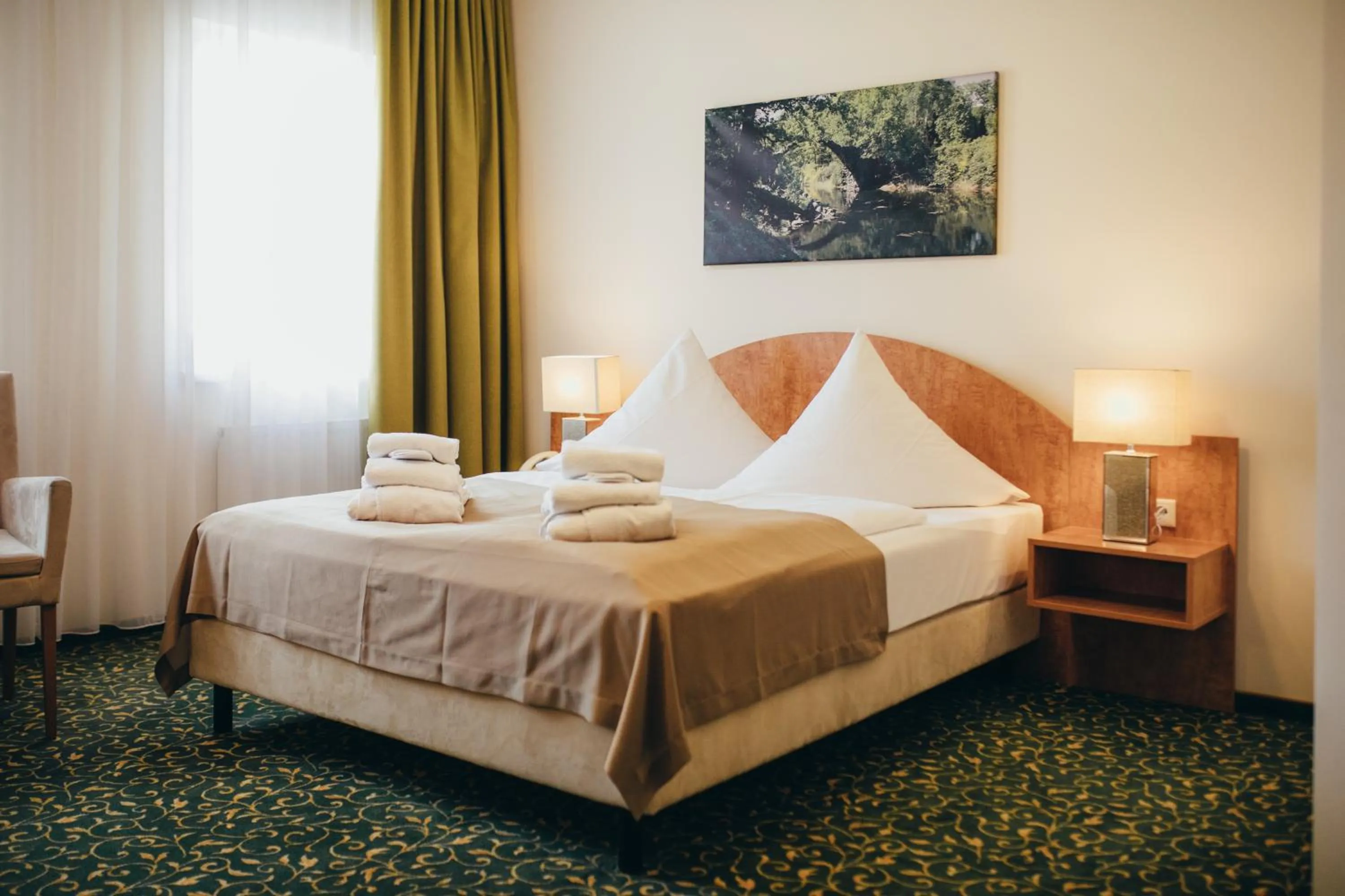 Photo of the whole room, Bed in Kulturhotel Fürst Pückler Park