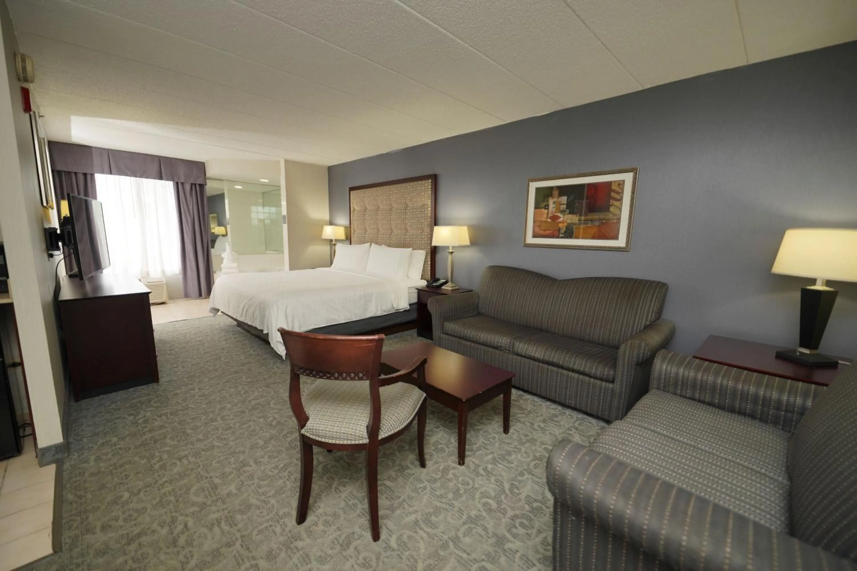 Bedroom, Bed in Holiday Inn & Suites Chicago-Carol Stream Wheaton by IHG