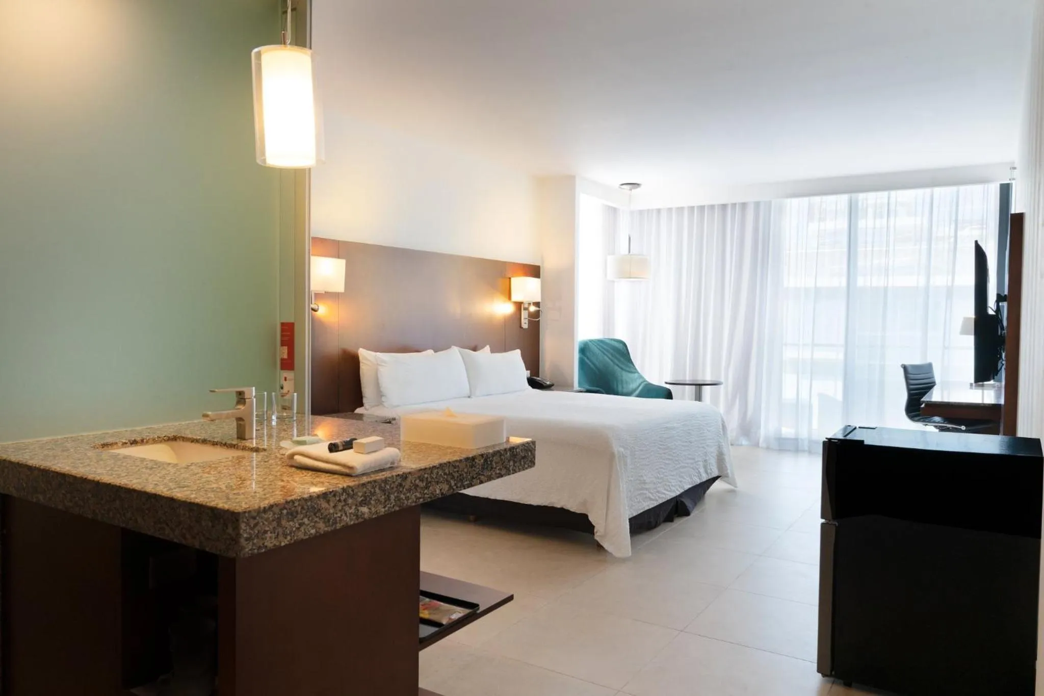 Photo of the whole room, Bed in Fiesta Inn Playa del Carmen