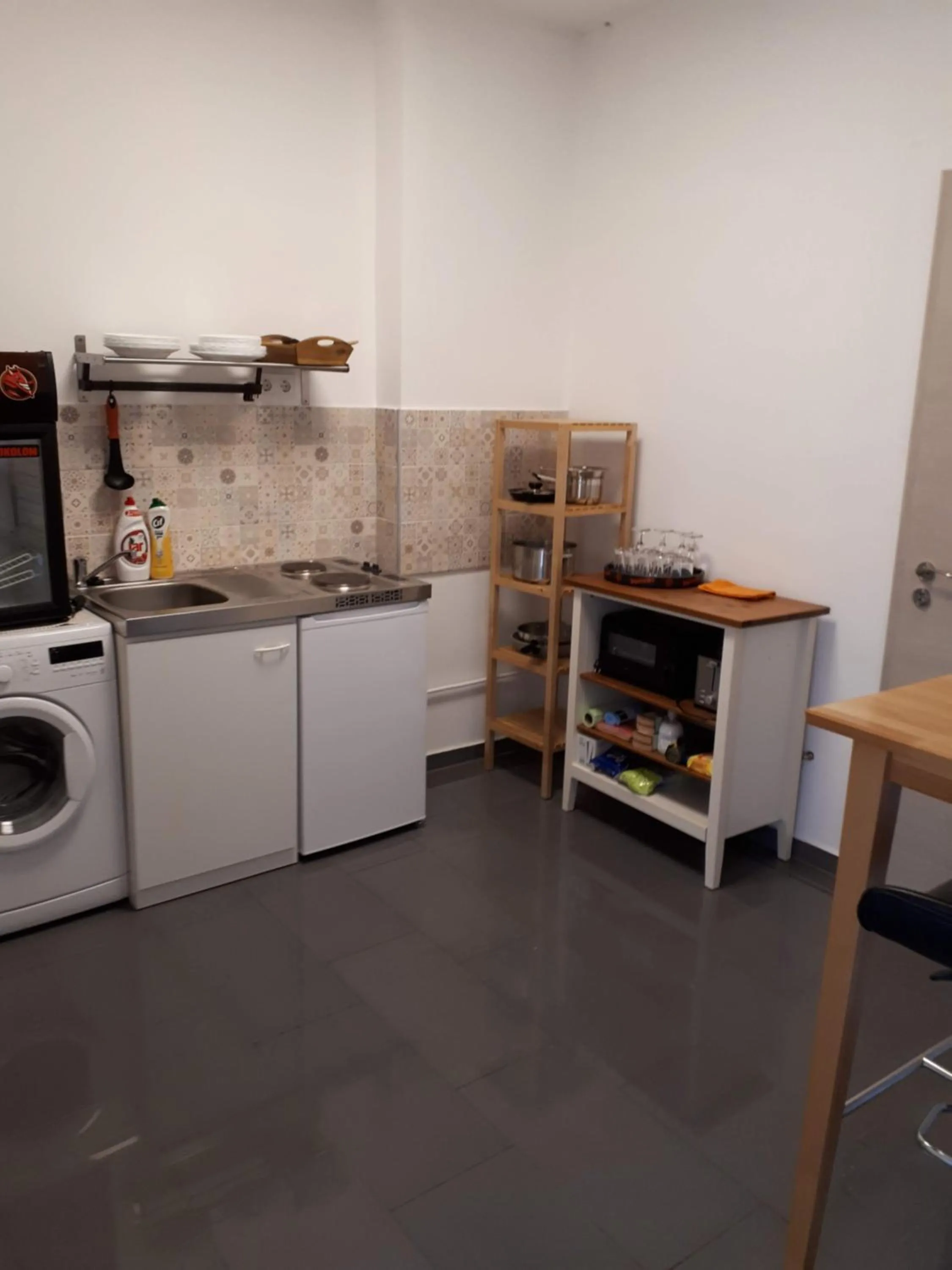 Kitchen or kitchenette in Kertvárosi Apartman
