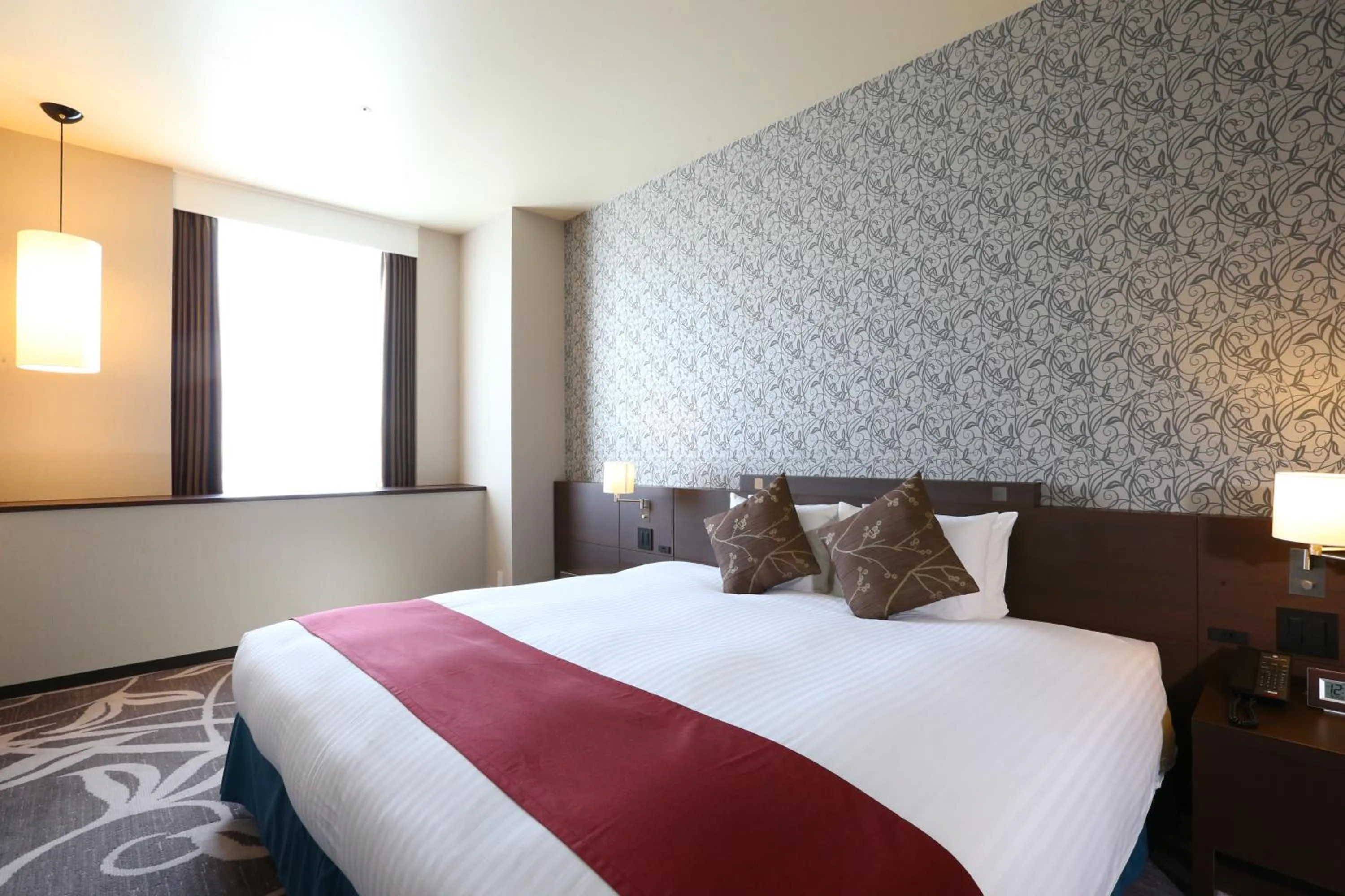 Bed in Hotel La Raison Osaka