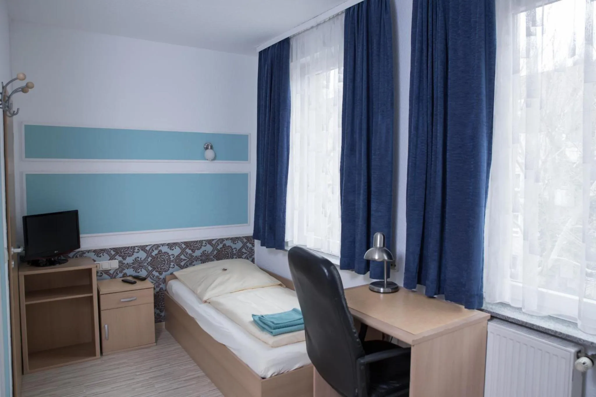 Bed in Pension Central Nuernberg-Fuerth