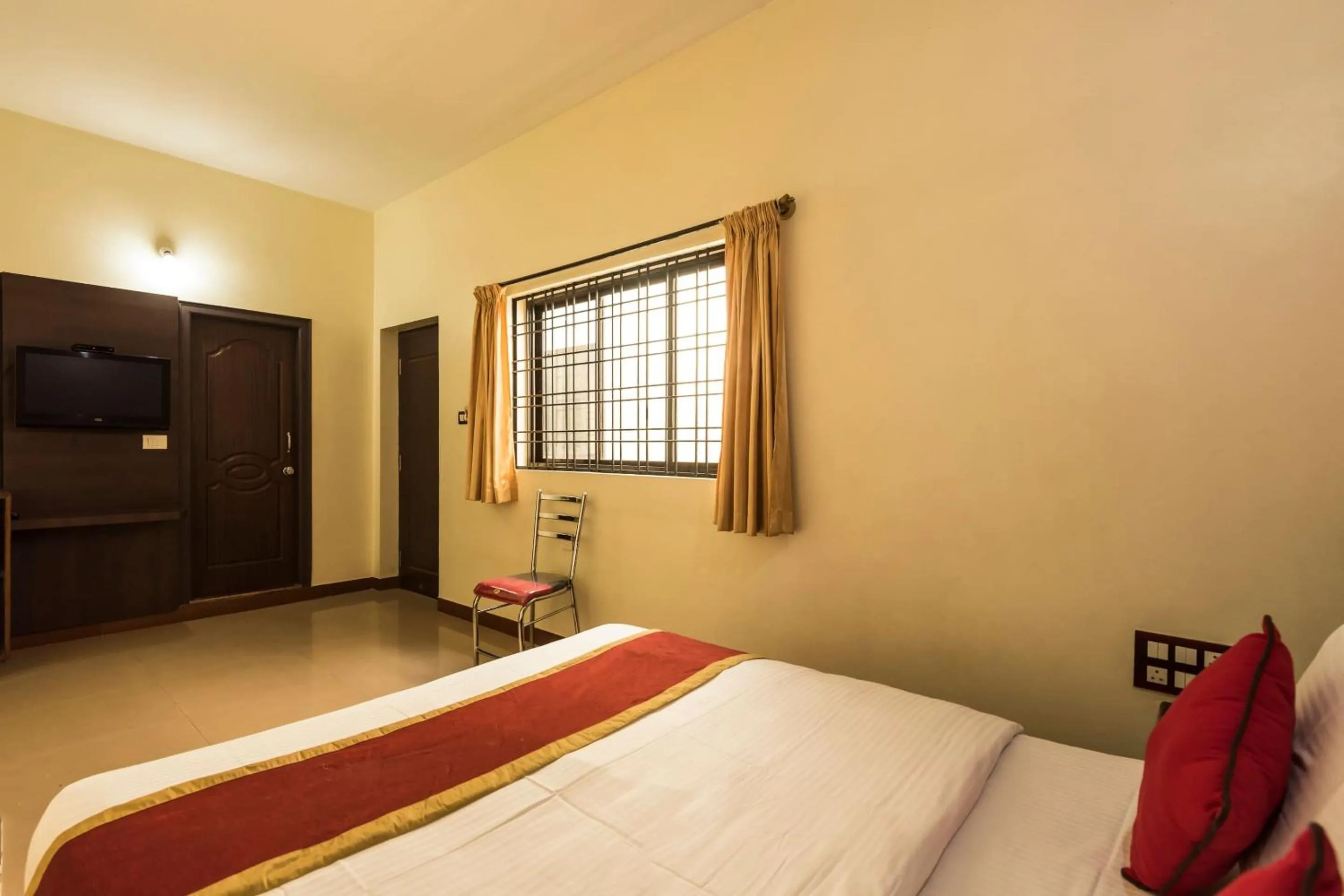 Bedroom in Sai Kalyan suites