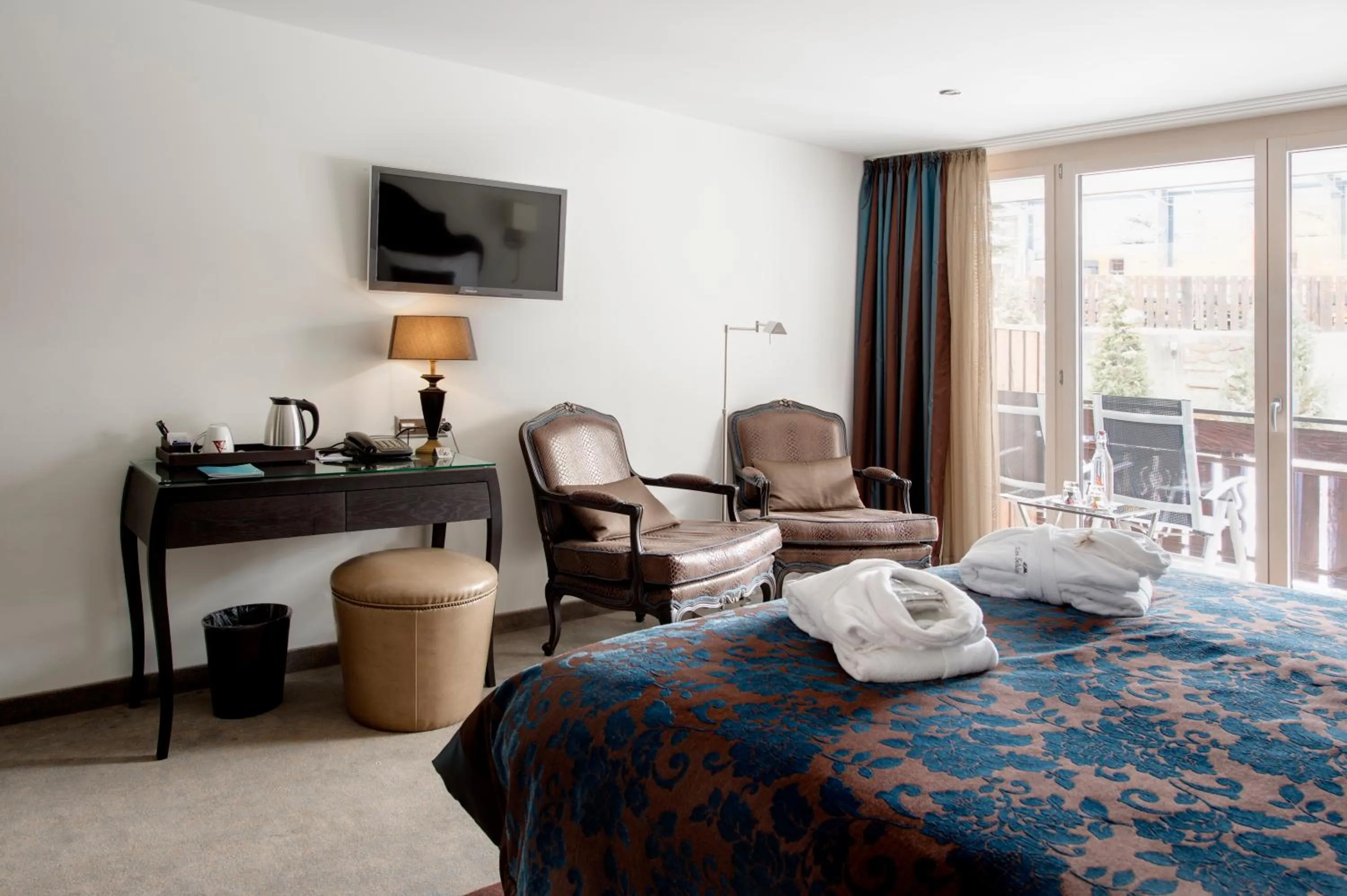 Bedroom, Seating Area in SchlossHotel Zermatt Active & CBD Spa Hotel