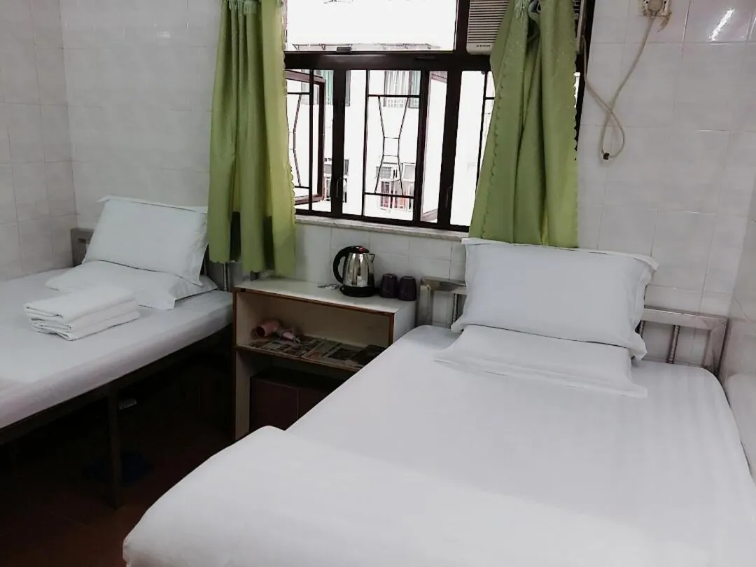 Bed in New Yan Yan Guest House reception 9th floor Flat E4 E6