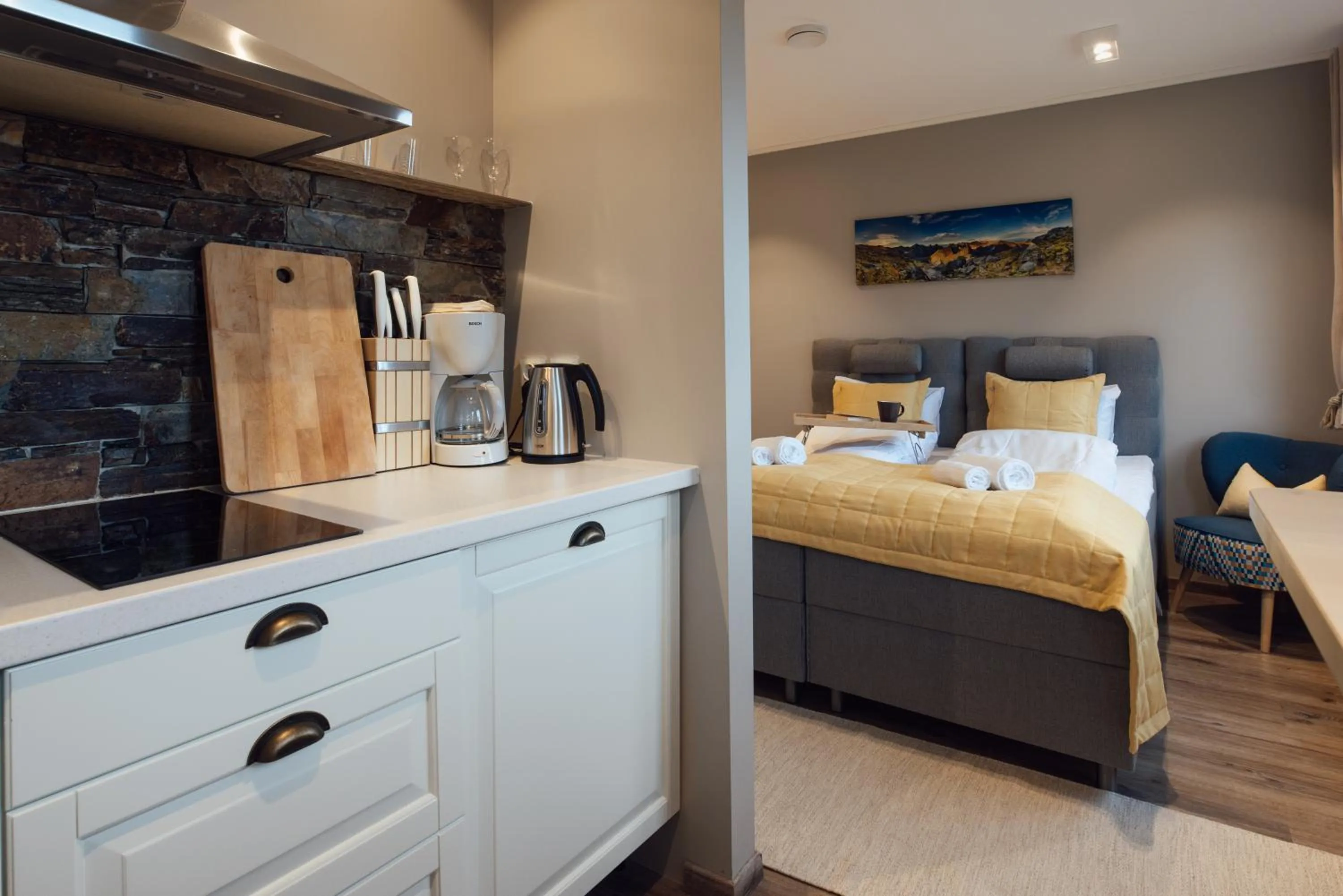 Kitchen or kitchenette, Bed in Lofoten Planet - Boutique Hotel