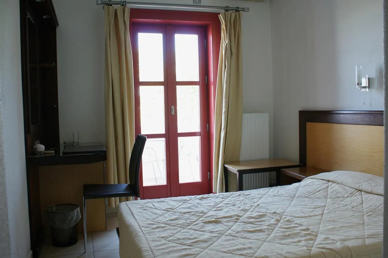 Bed in Aposperides Hotel