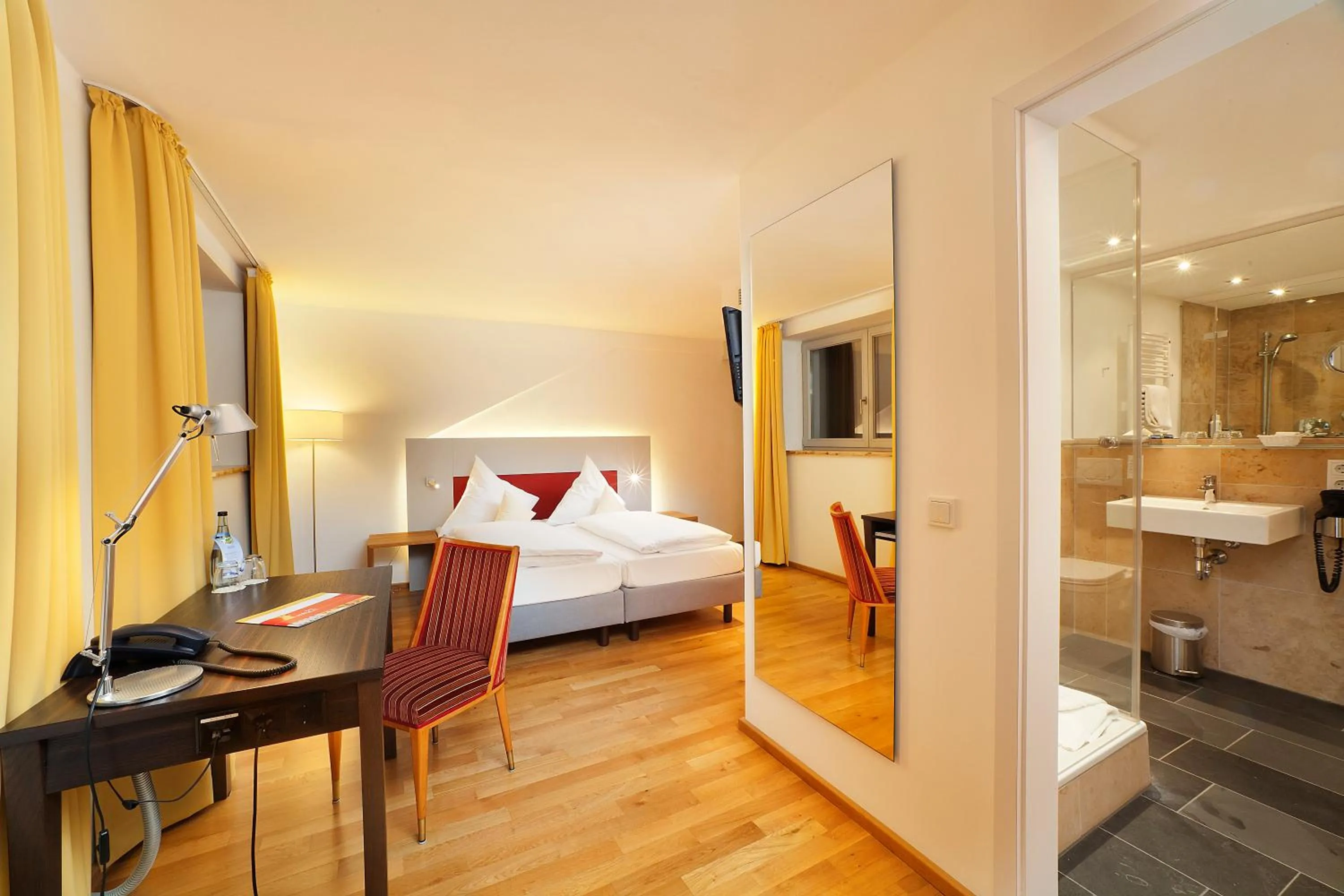 Seating area, Bed in AKZENT Brauerei Hotel Hirsch