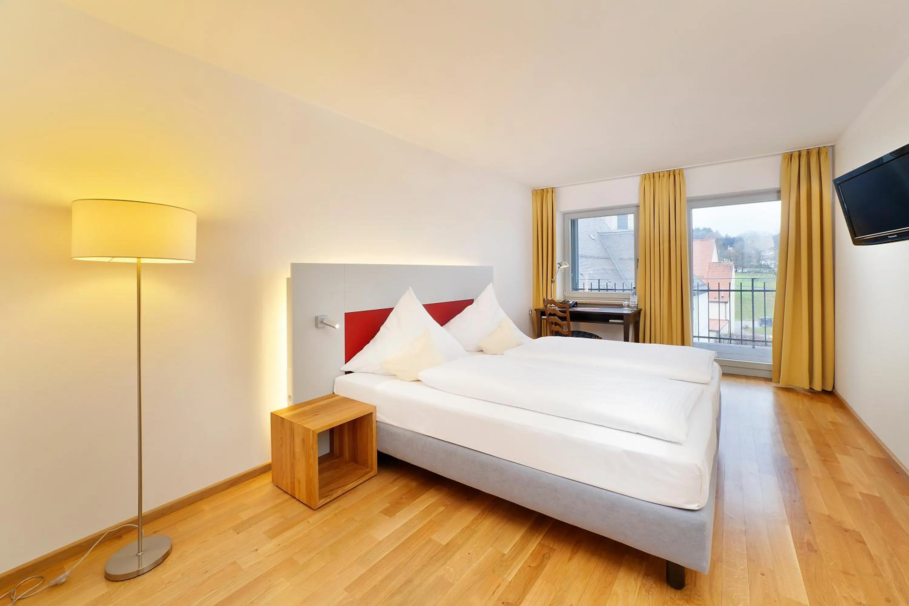 Photo of the whole room, Bed in AKZENT Brauerei Hotel Hirsch